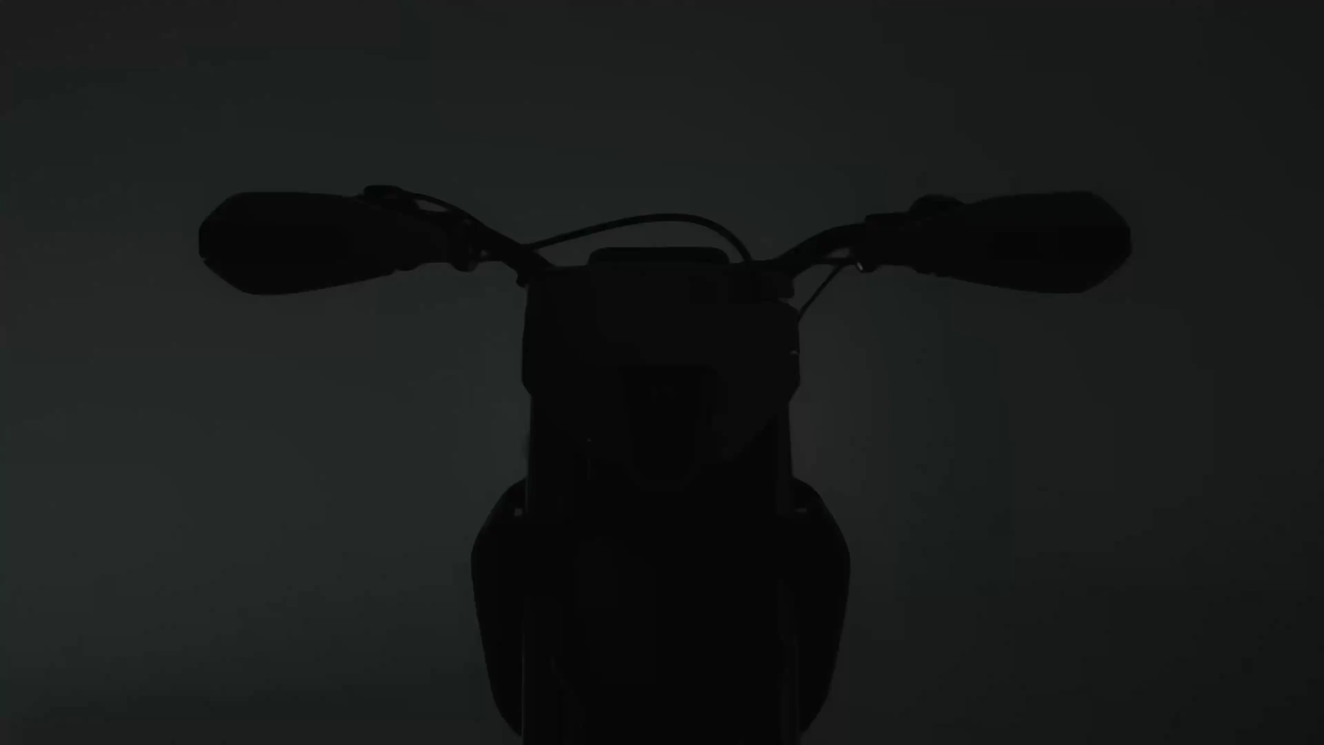 Yellow and black off-road dirt bike with knobby tires and visible suspension components.