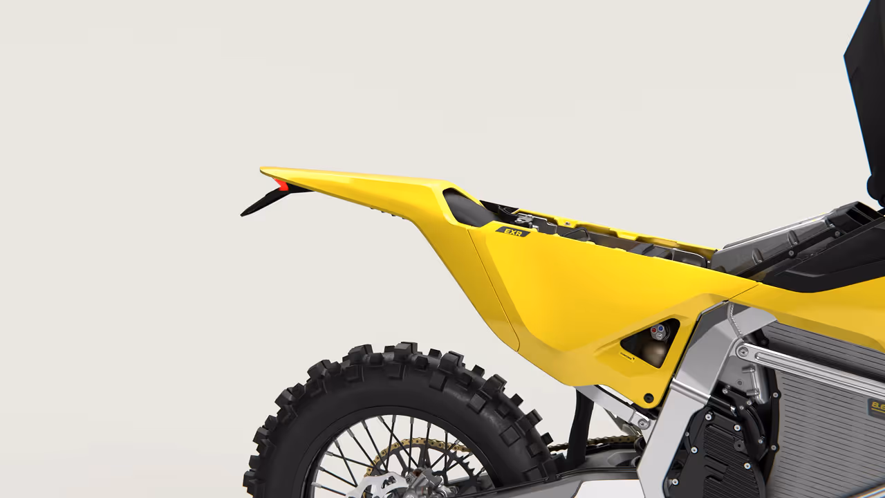 Yellow and black off-road dirt bike with knobby tires and visible suspension components.