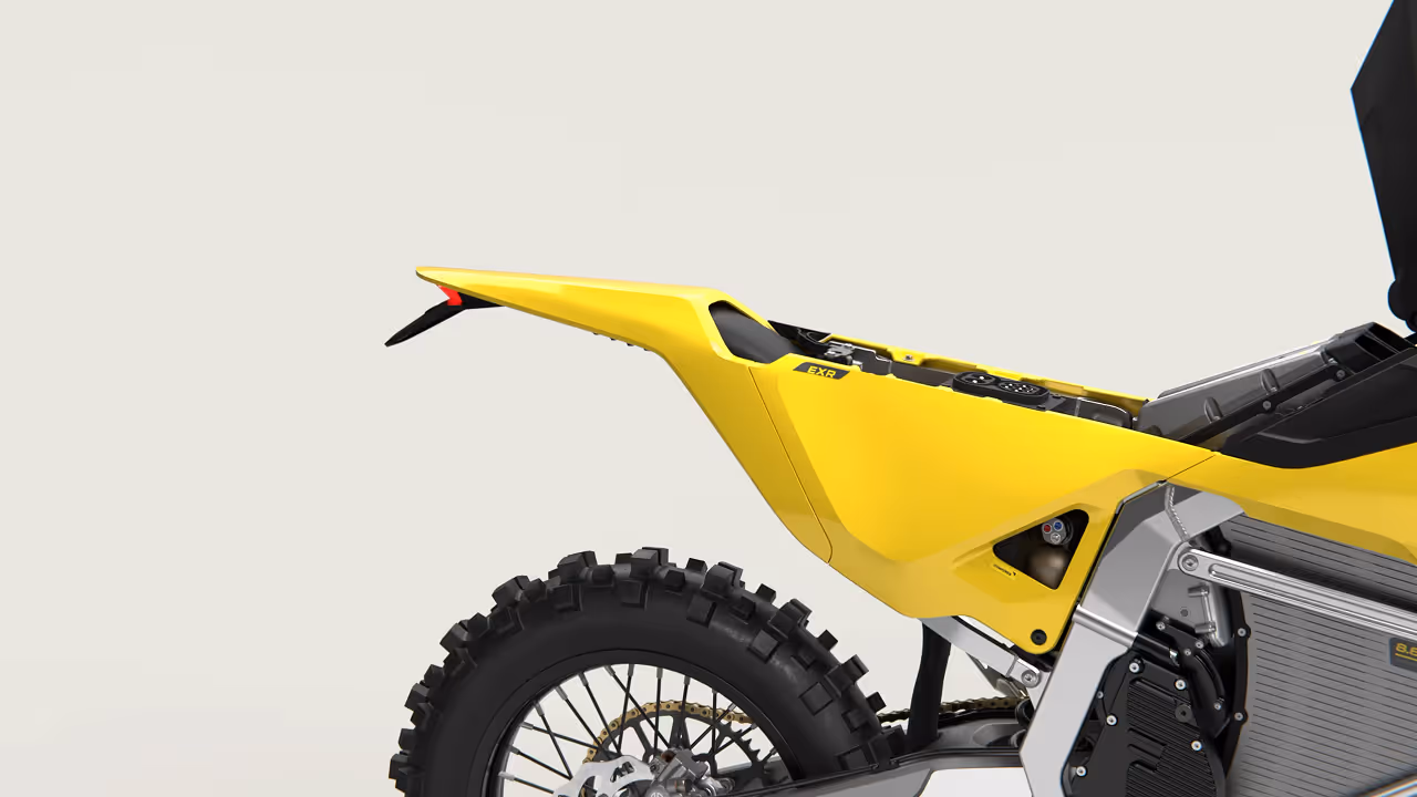 Yellow and black off-road dirt bike with knobby tires and visible suspension components.