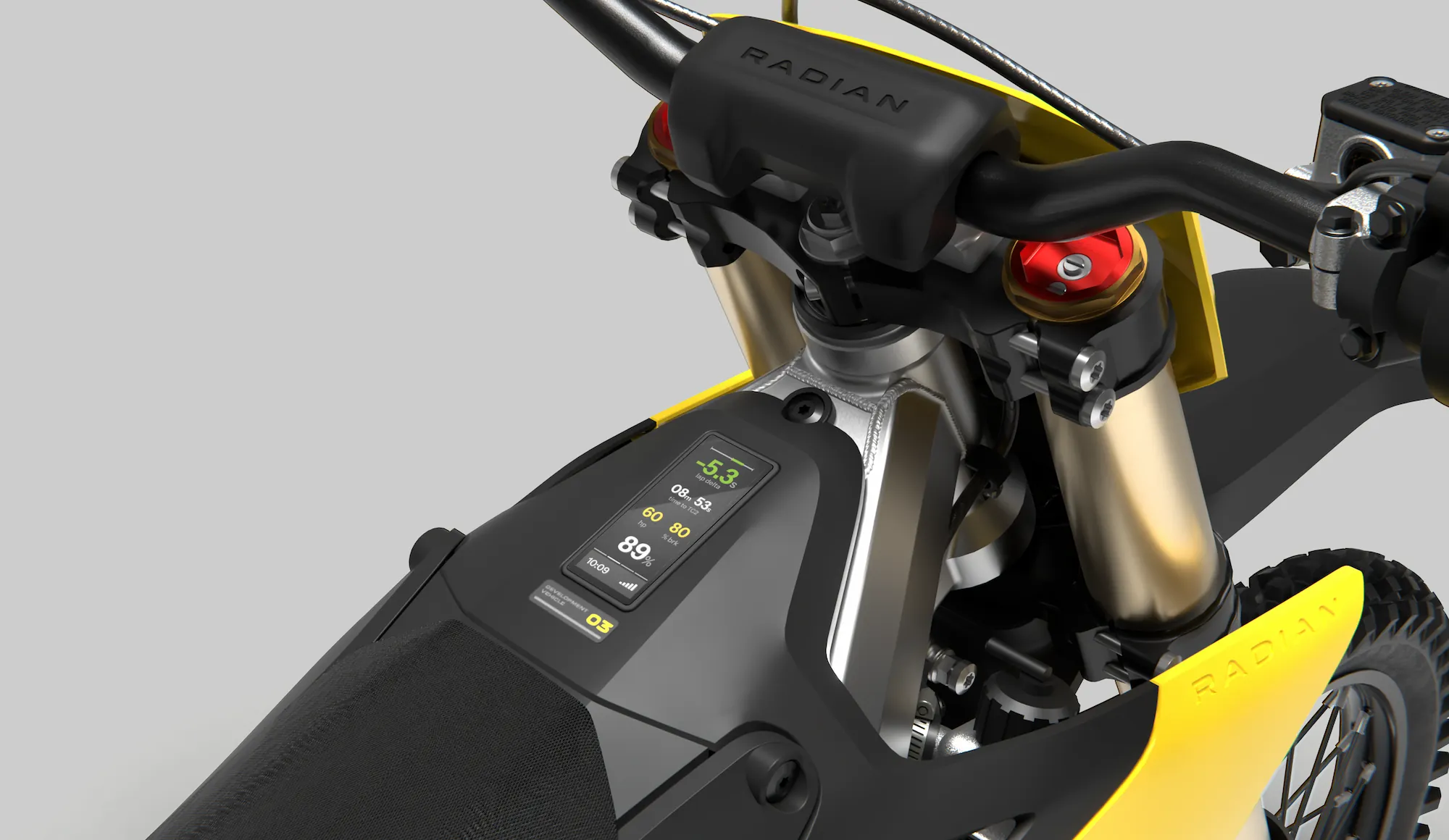 Close-up of a yellow and black Radian dirt bike handlebar and digital display with riding metrics.