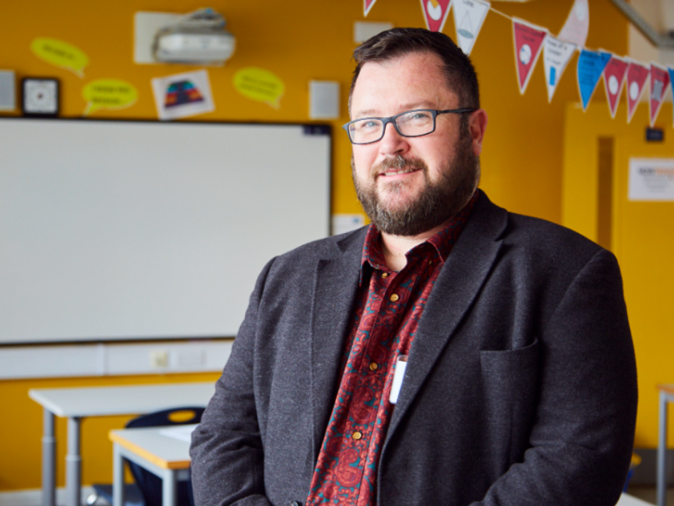 Now Teach website carousel image showing a teacher or career-changer in a school setting.