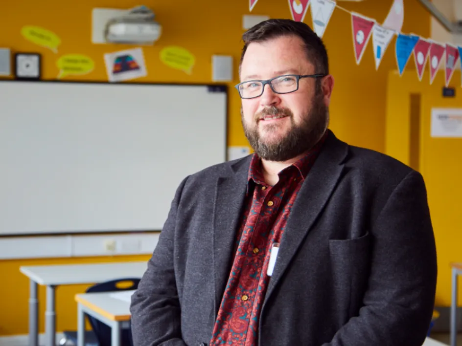 Now Teach website carousel image showing a teacher or career-changer in a school setting.