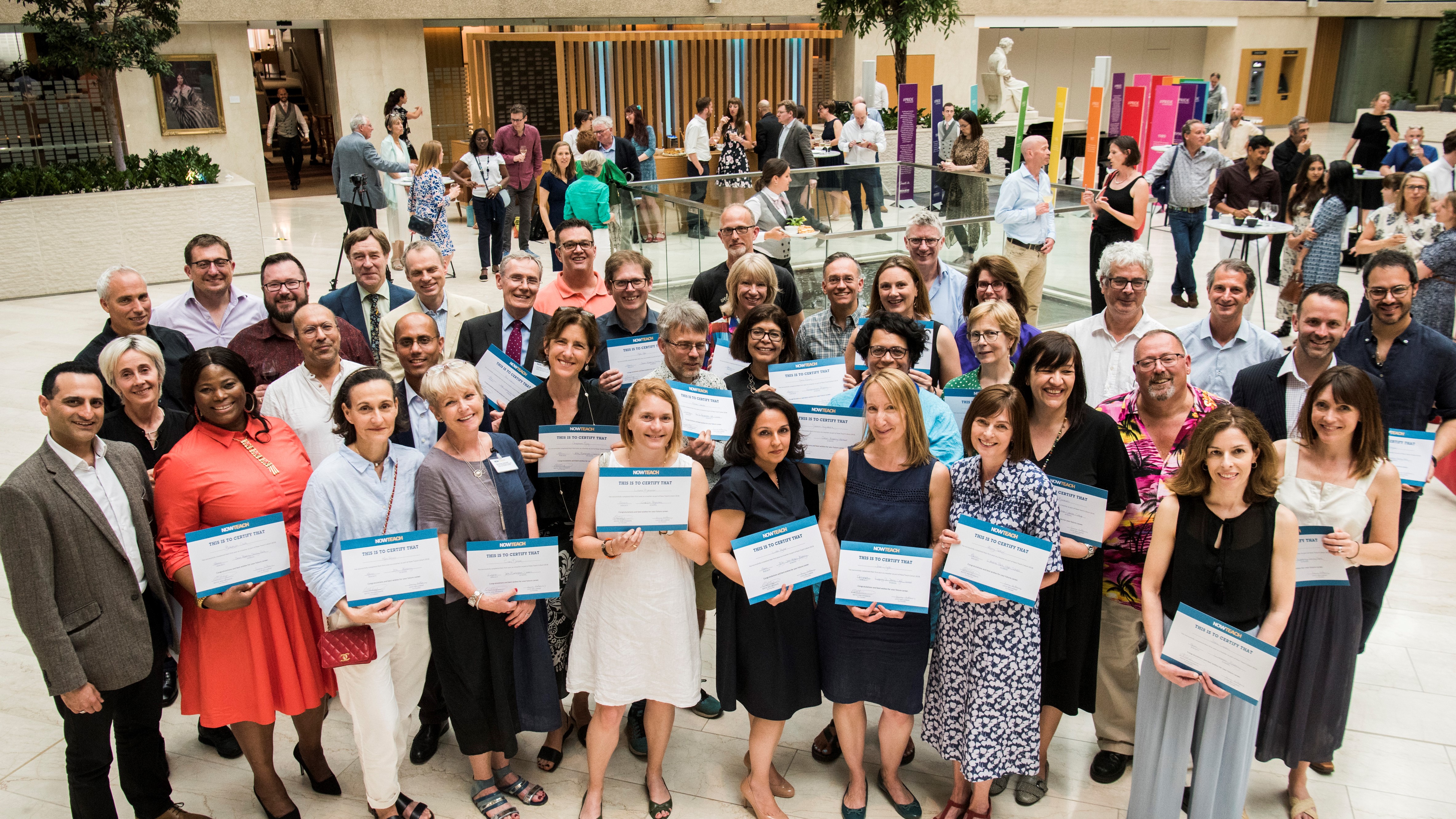 Group of Now Teach trainees celebrating at a graduation or qualification ceremony.