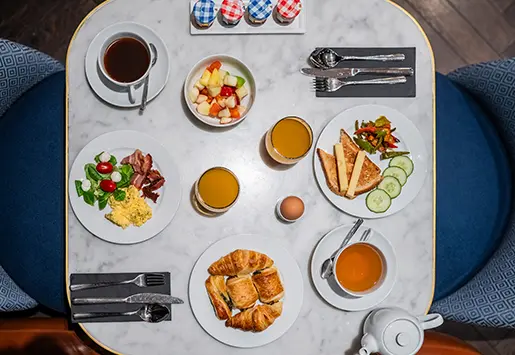 View of a table with breakfast at the Hotel Square Louvois Paris