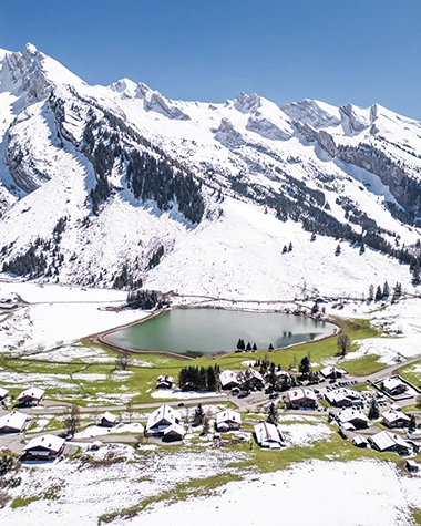 Snowy mountains and Lac des Confins in La Clusaz