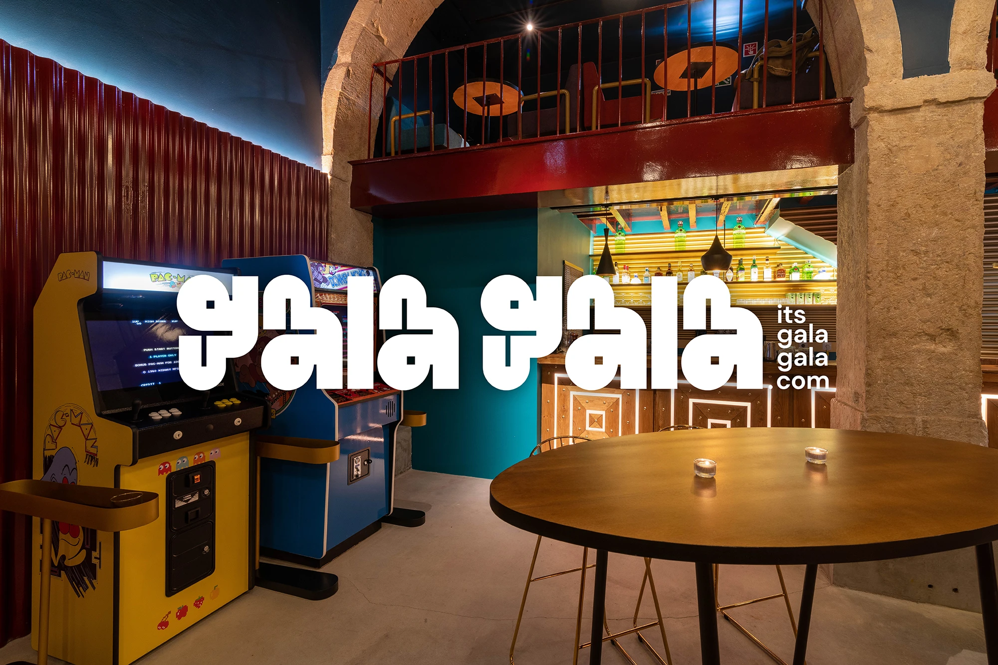 Gala Gala arcade and cocktail bar interior in Lisbon with arcade machines and brand logo overlay, designed by Miguel Dias
