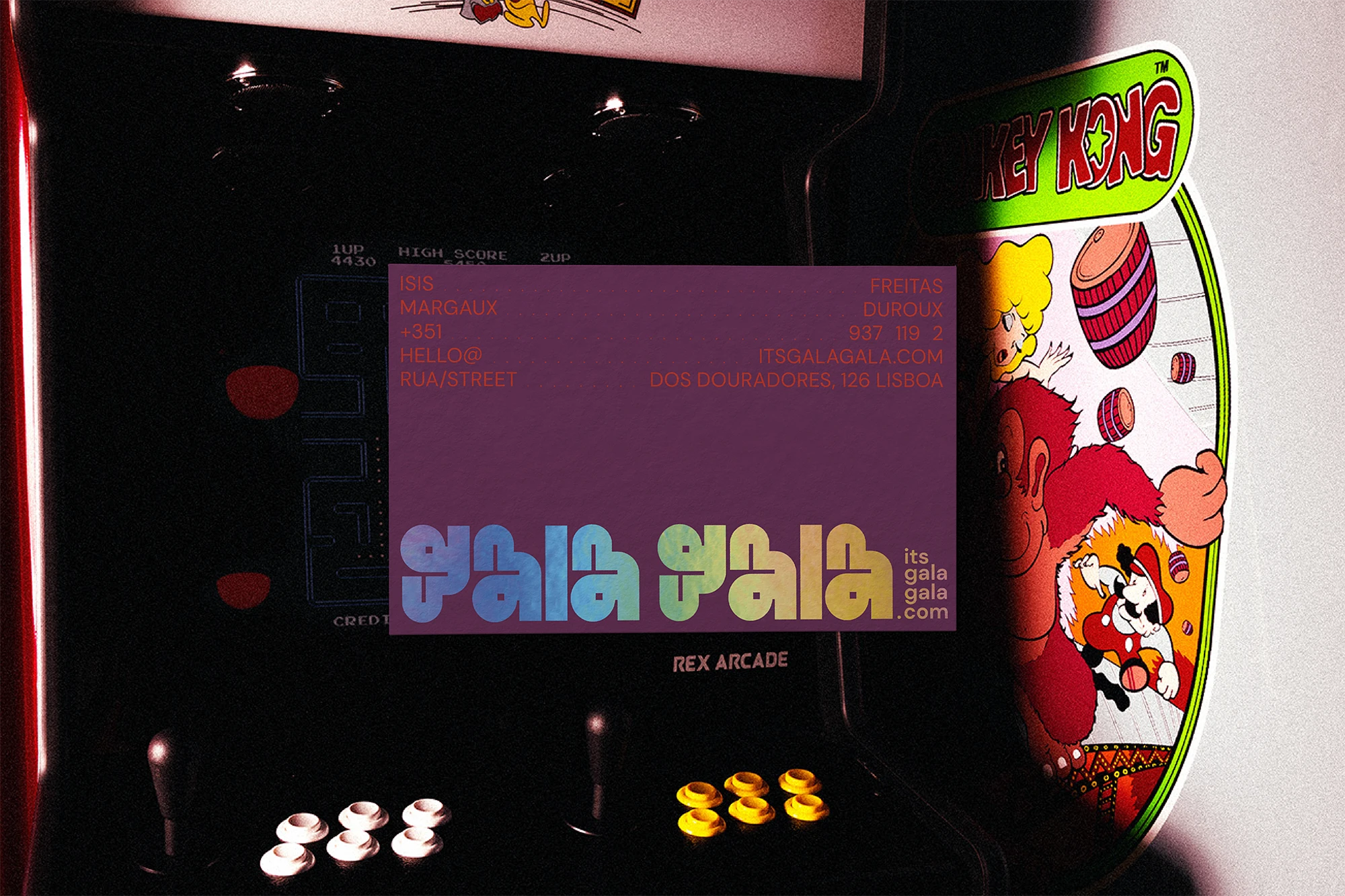 Gala Gala business cards displayed on arcade machine screen
