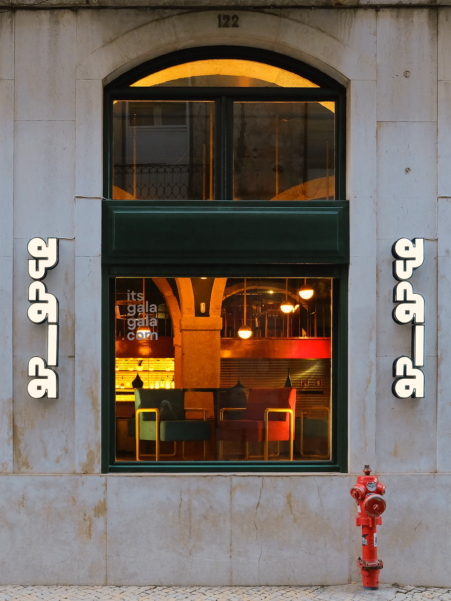 Gala Gala arcade and cocktail bar exterior facade with brand signage in Lisbon
