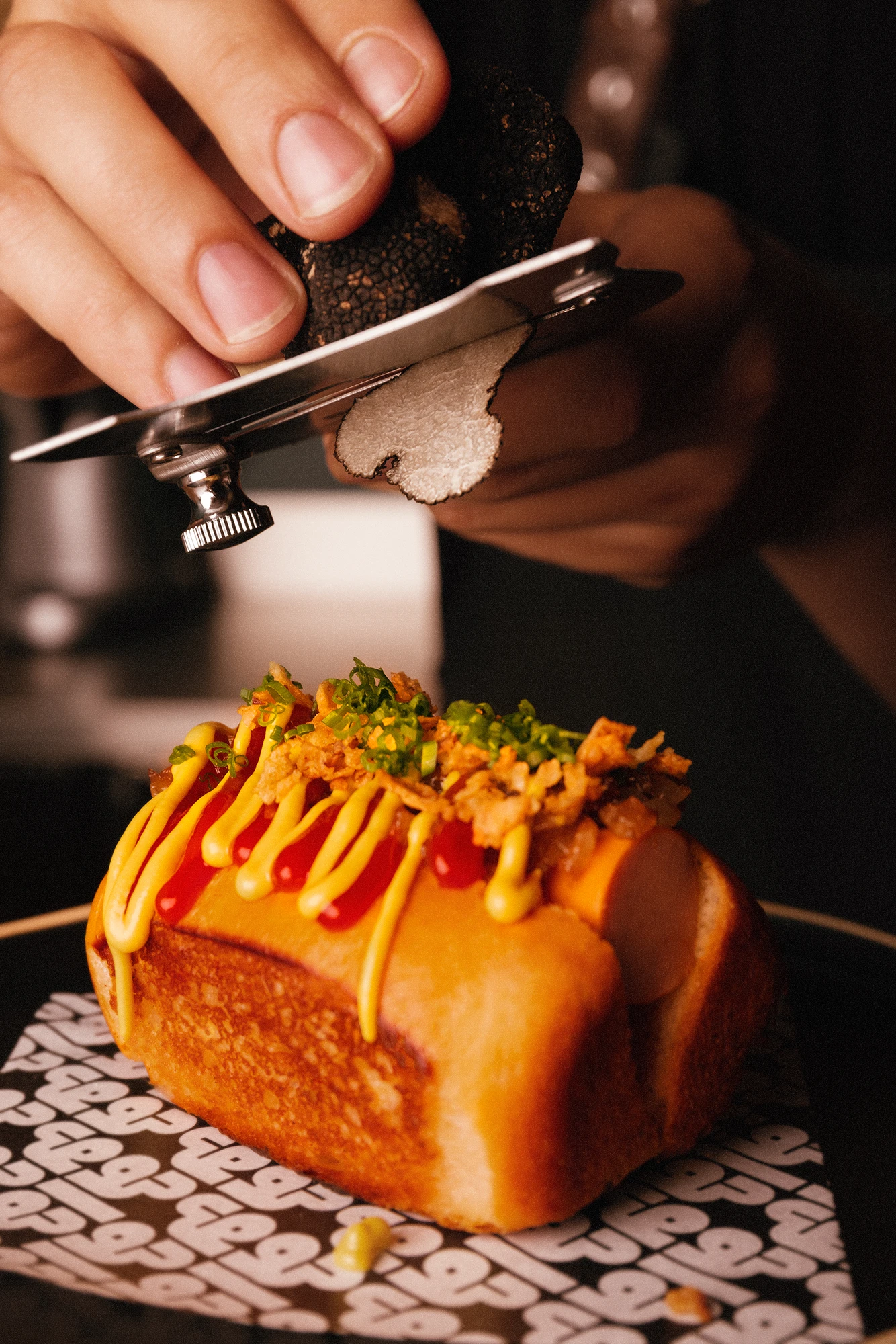 Gala Gala branded food photography showing a loaded hot dog on patterned paper
