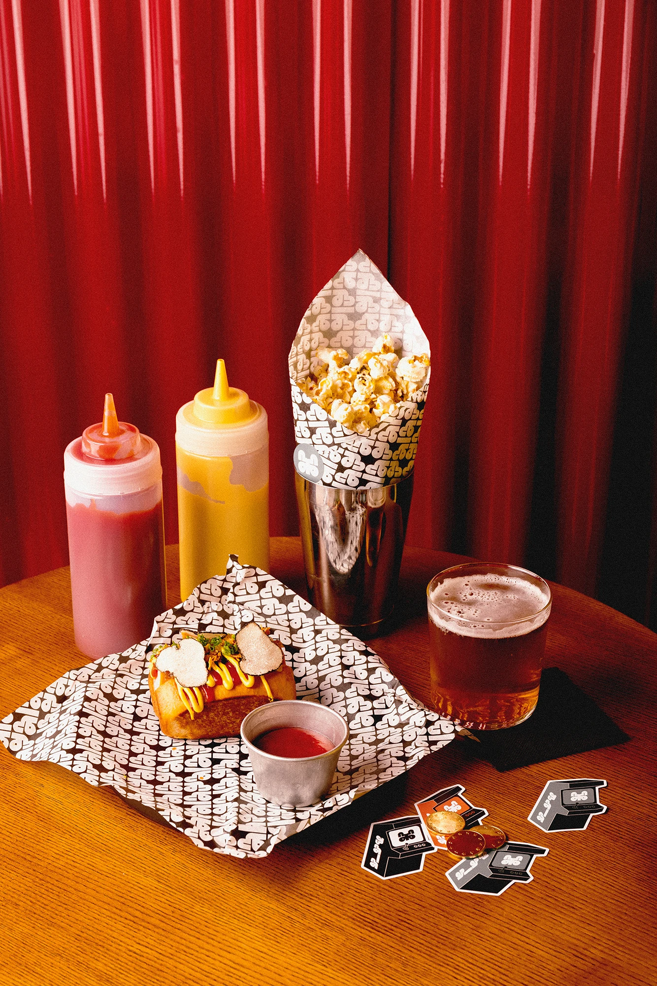 Gala Gala branded cocktail on a table with brand stickers and coasters
