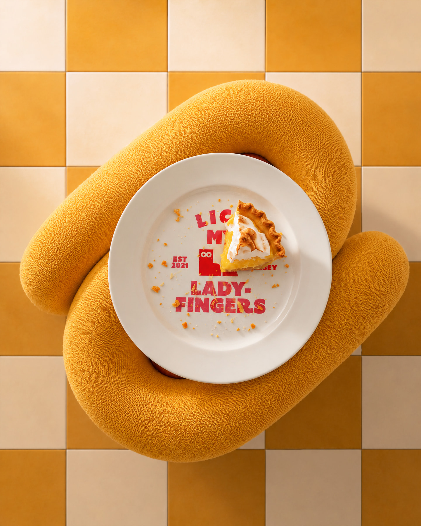 Ladyfingers branded plate with pastry on yellow checkerboard surface, overhead shot