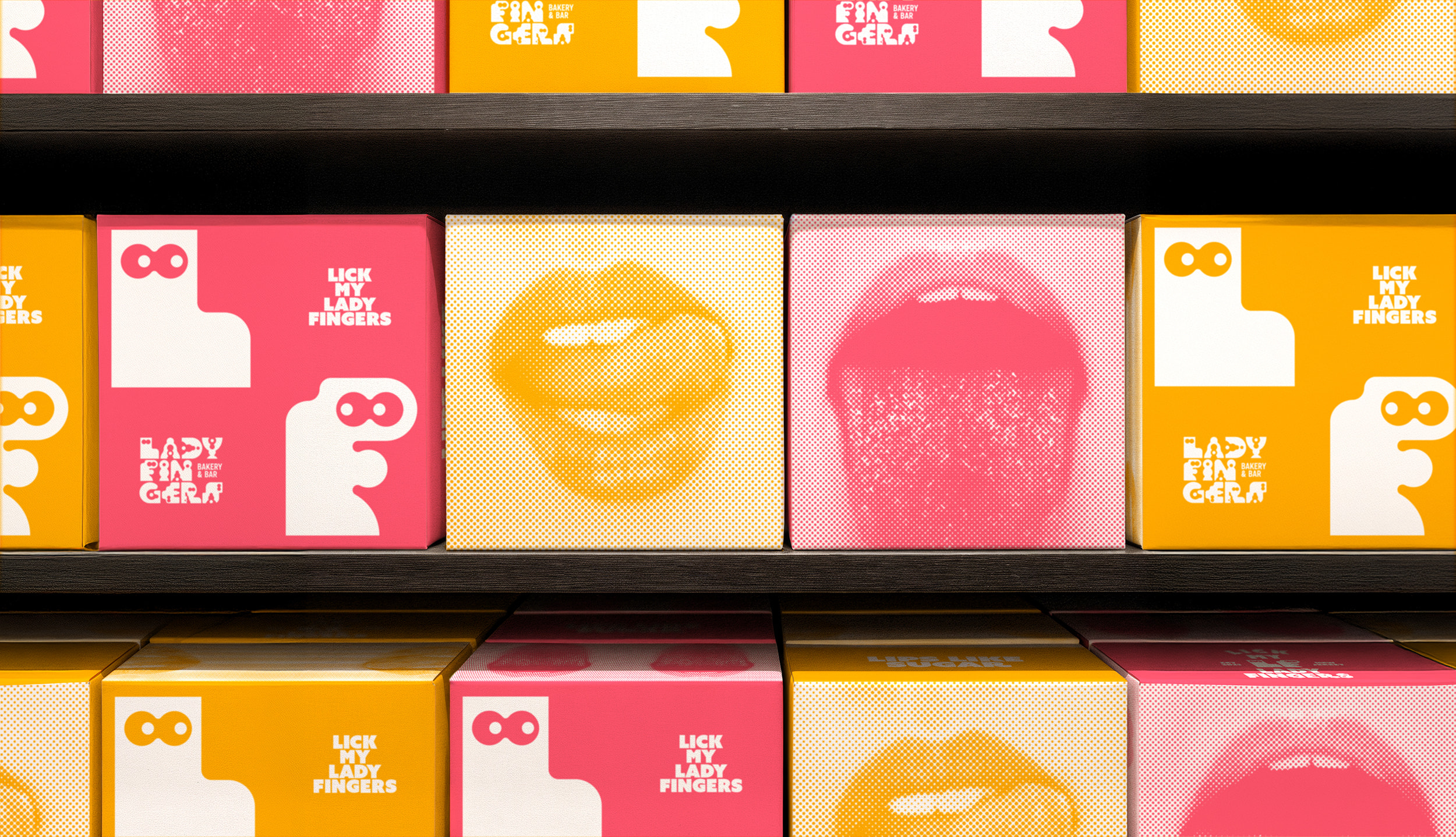 Ladyfingers Bakery and Bar packaging boxes displayed on a shelf with brand patterns

