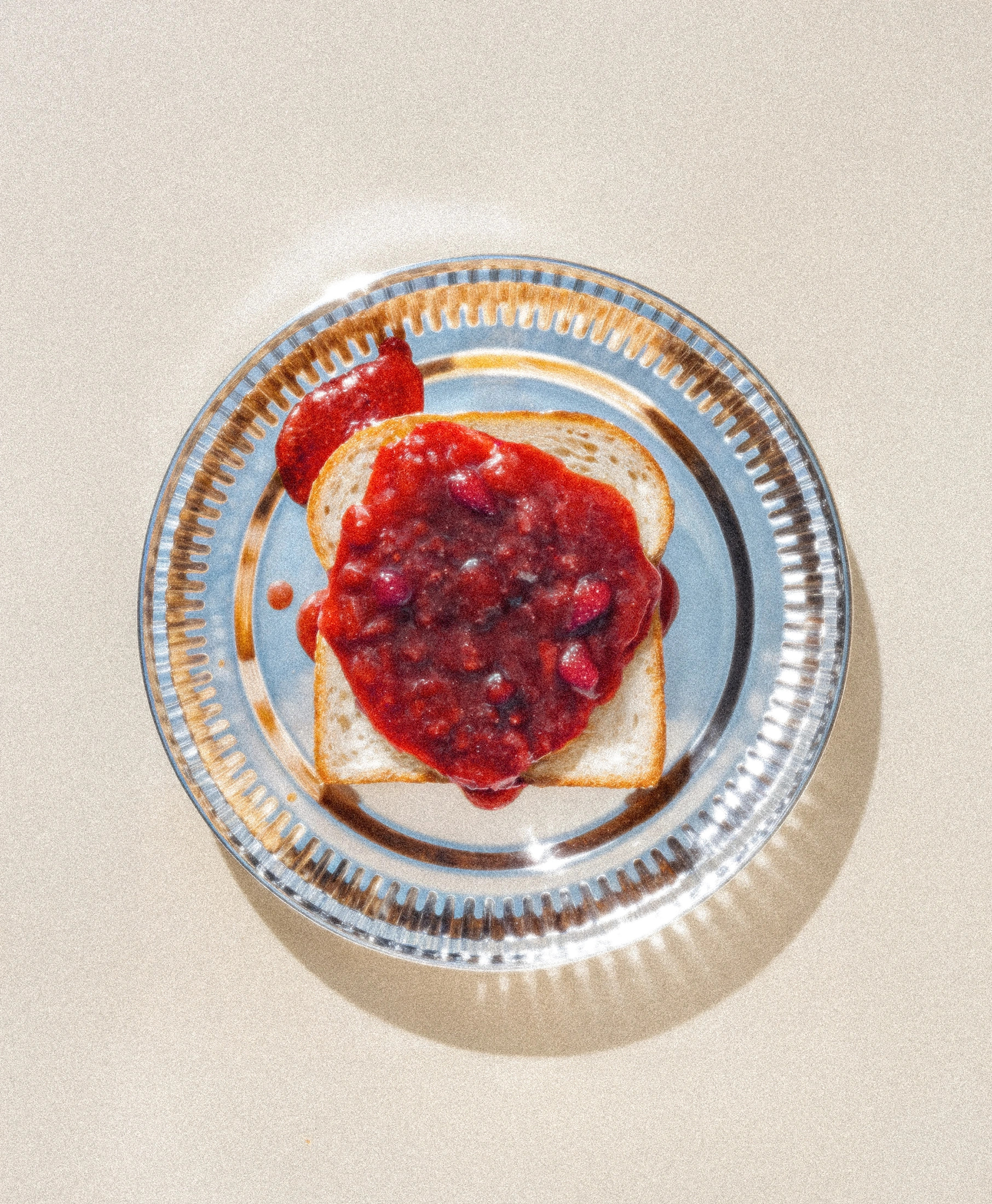 Celeste jam served on toast on a silver plate, overhead product photography