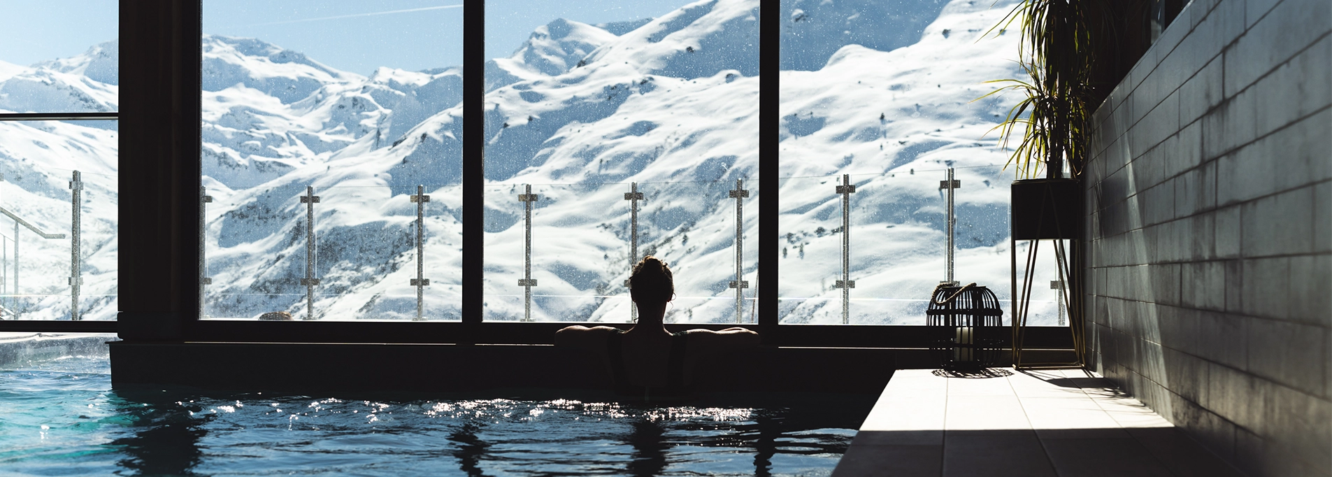 Woman in the pool overlooking the Massif de la Masse aux Menuires