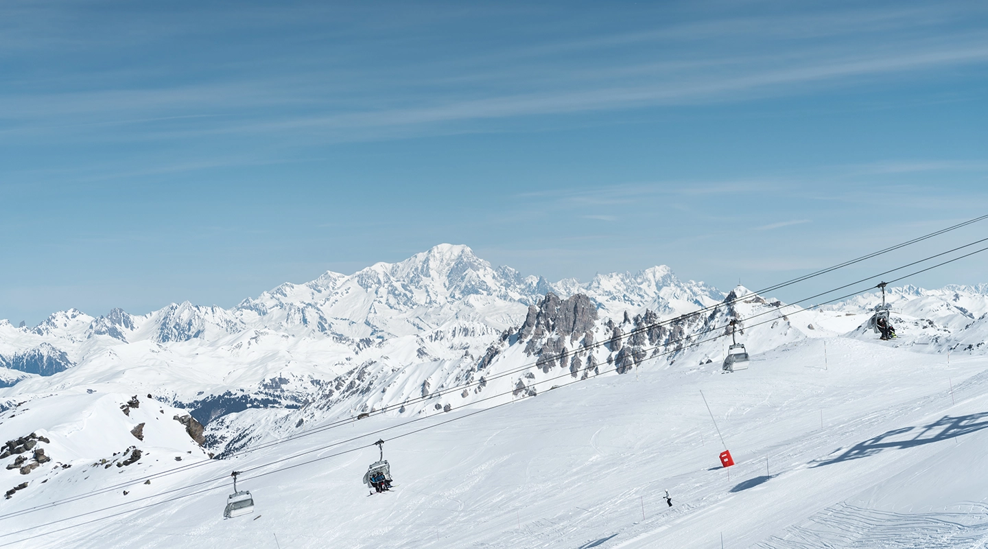 Snowy mountains in Les Menuires with chairlift
