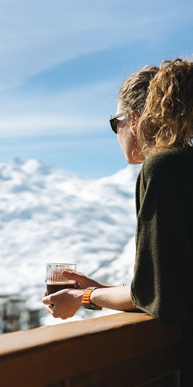 Woman on the balcony of the Ours Blanc hotel