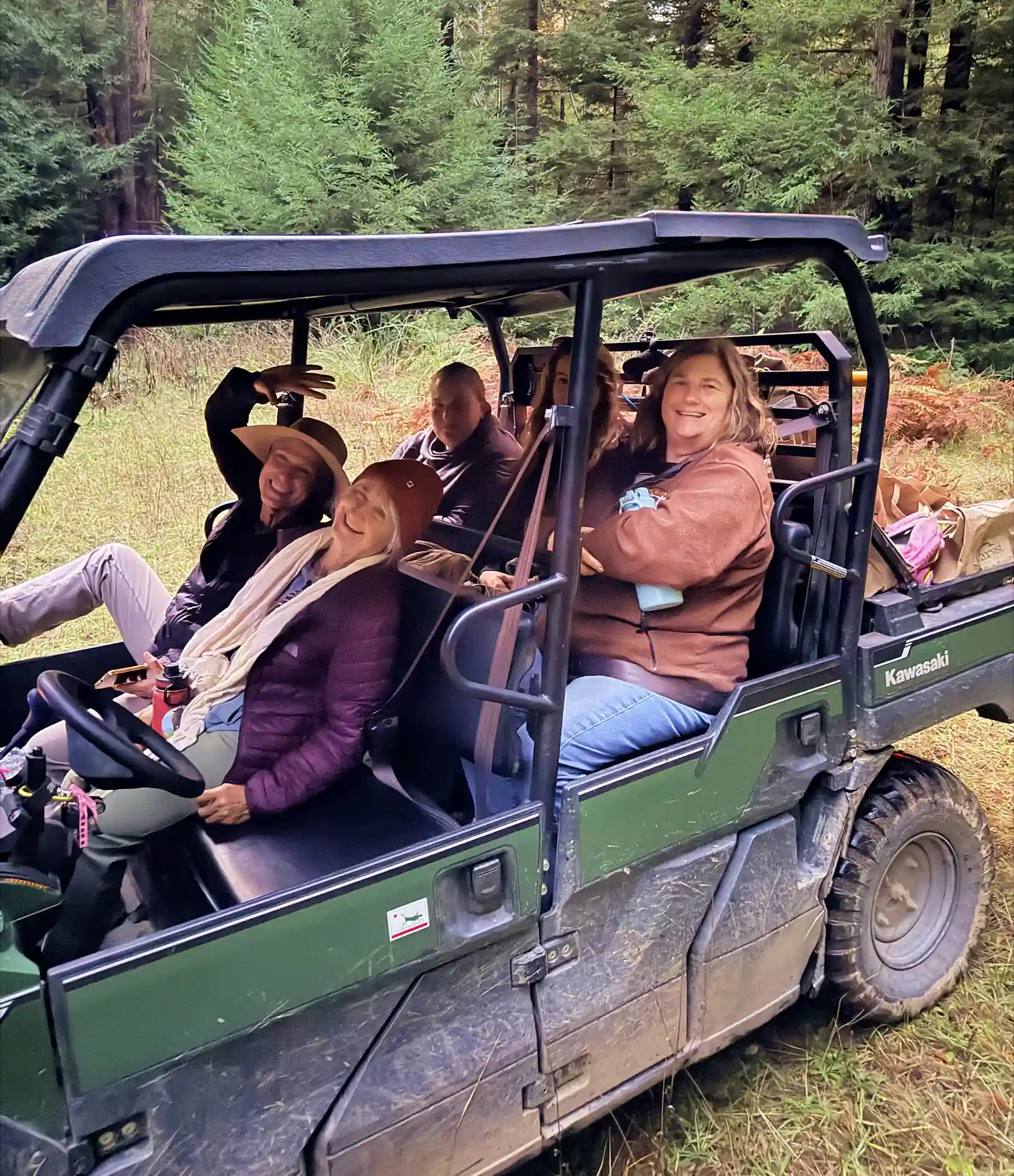 An ATV travelling along a trail beside Usal Redwood Forest.