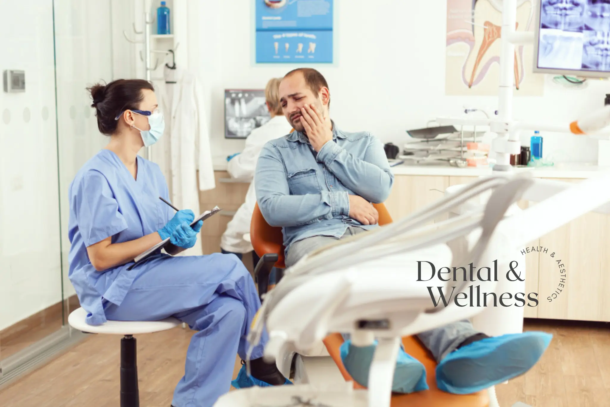 Emergency tooth extraction: dental nurse taking notes while a patient holds his jaw in pain in the dental chair