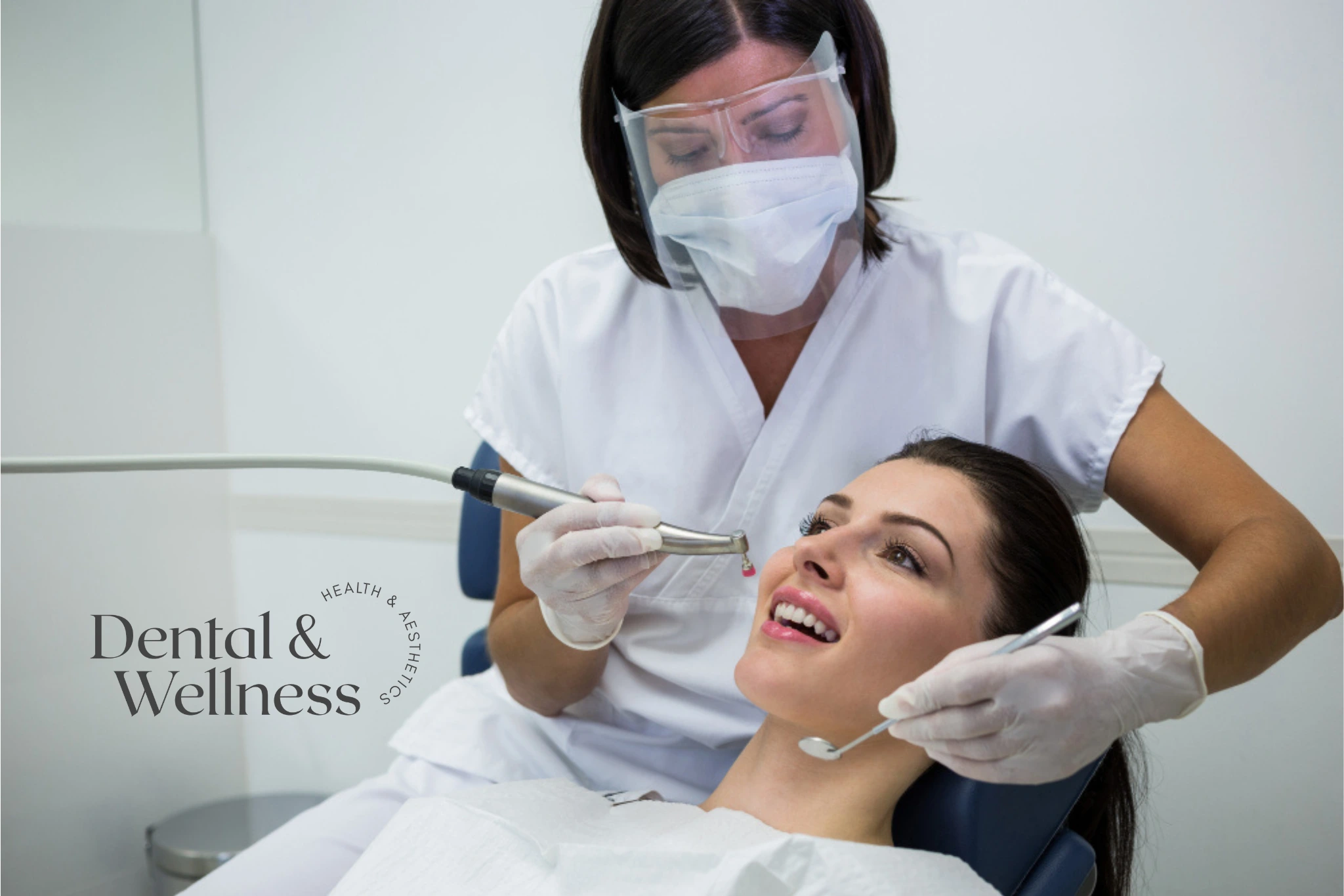 Dentist in a face shield treating a smiling patient