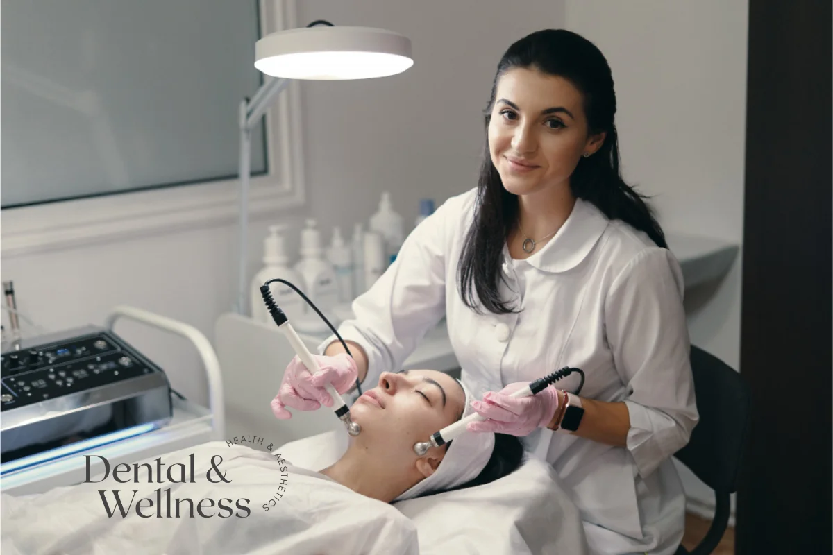 Therapist carrying out a HydraFacial treatment on a reclining client