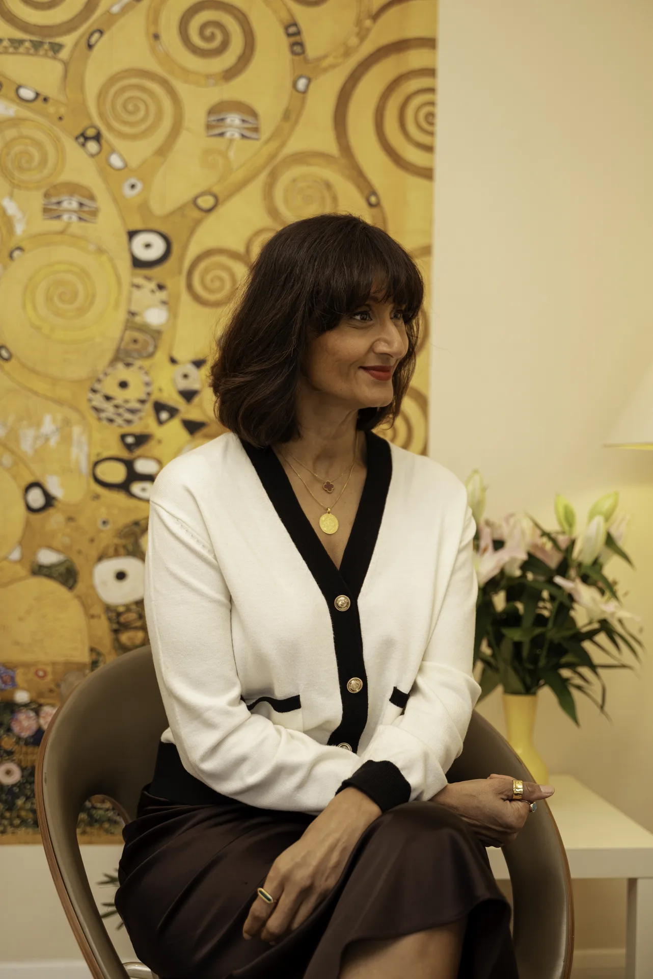 Coach seated in the clinic lounge — confidence coaching