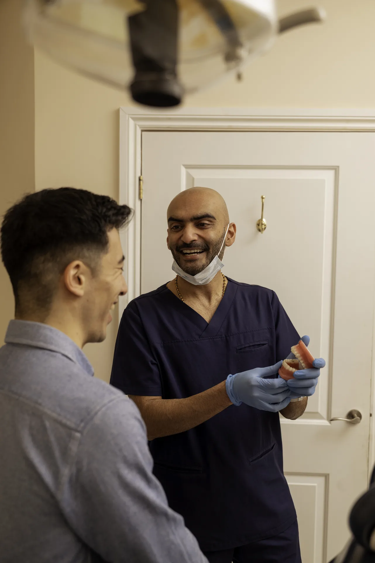 Mercury fillings: dentist chatting with a patient in the treatment room