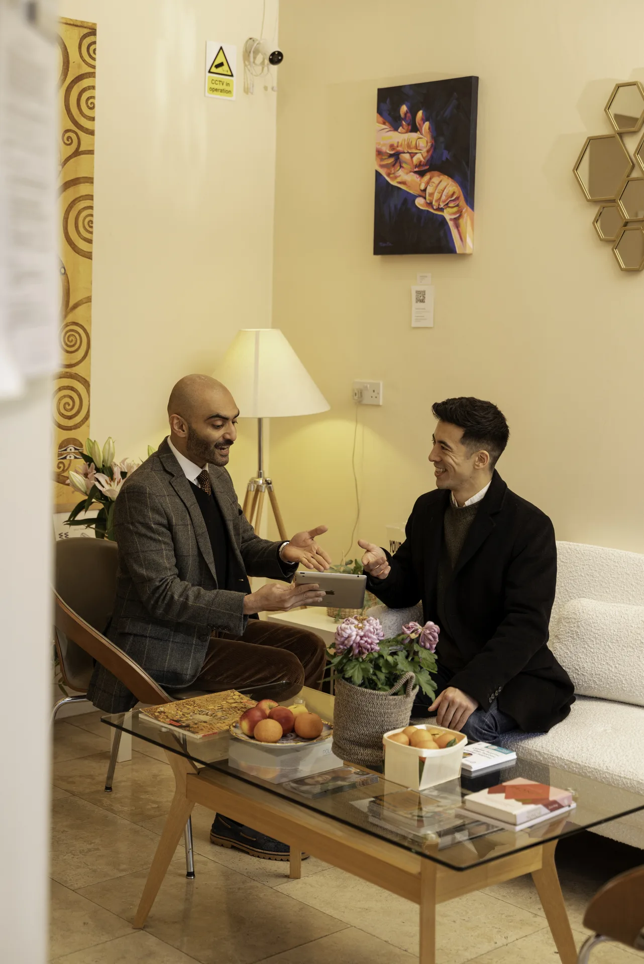Clinician and patient in consultation in the clinic lounge