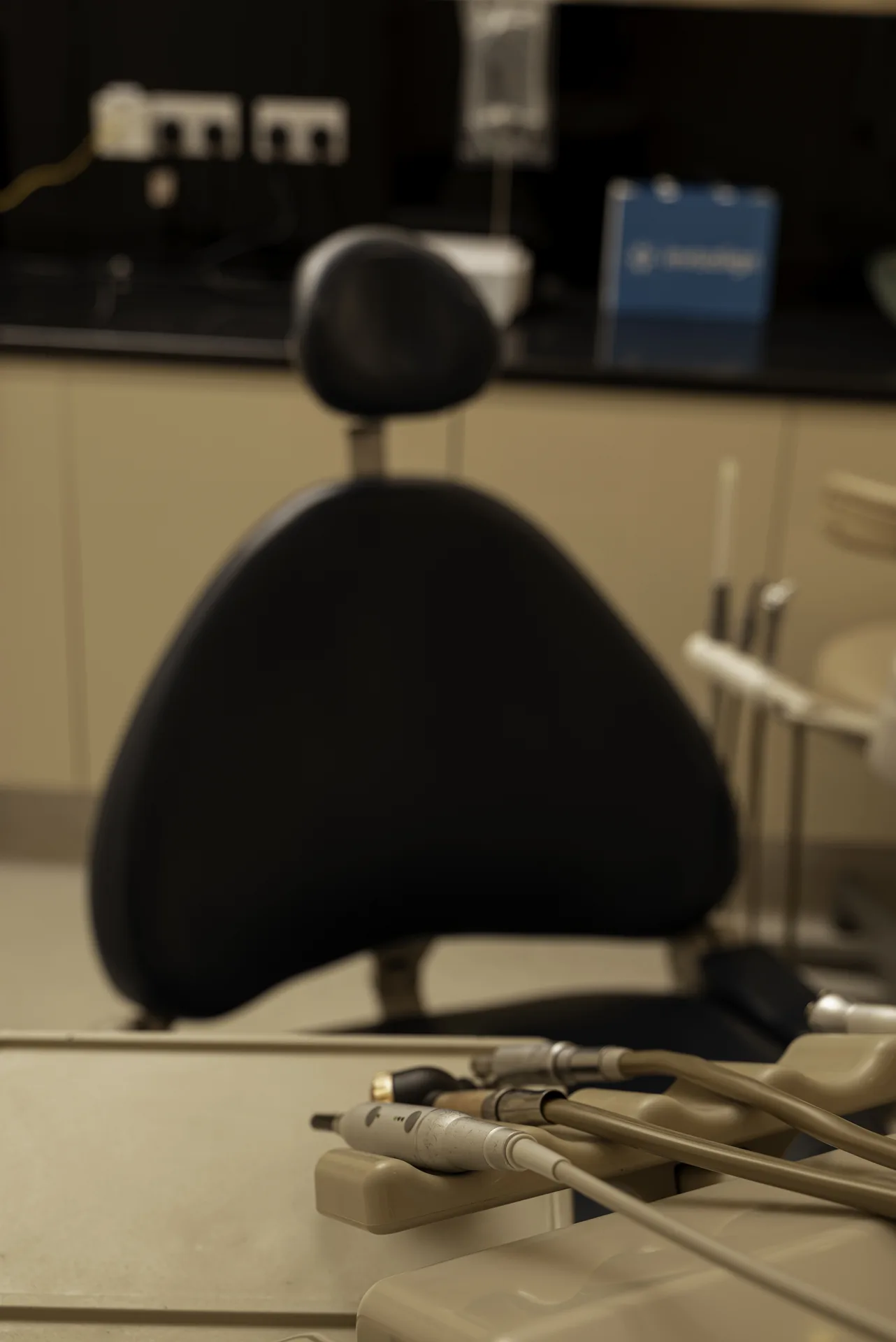 Dental implant aftercare: empty dental chair in a treatment room at the clinic
