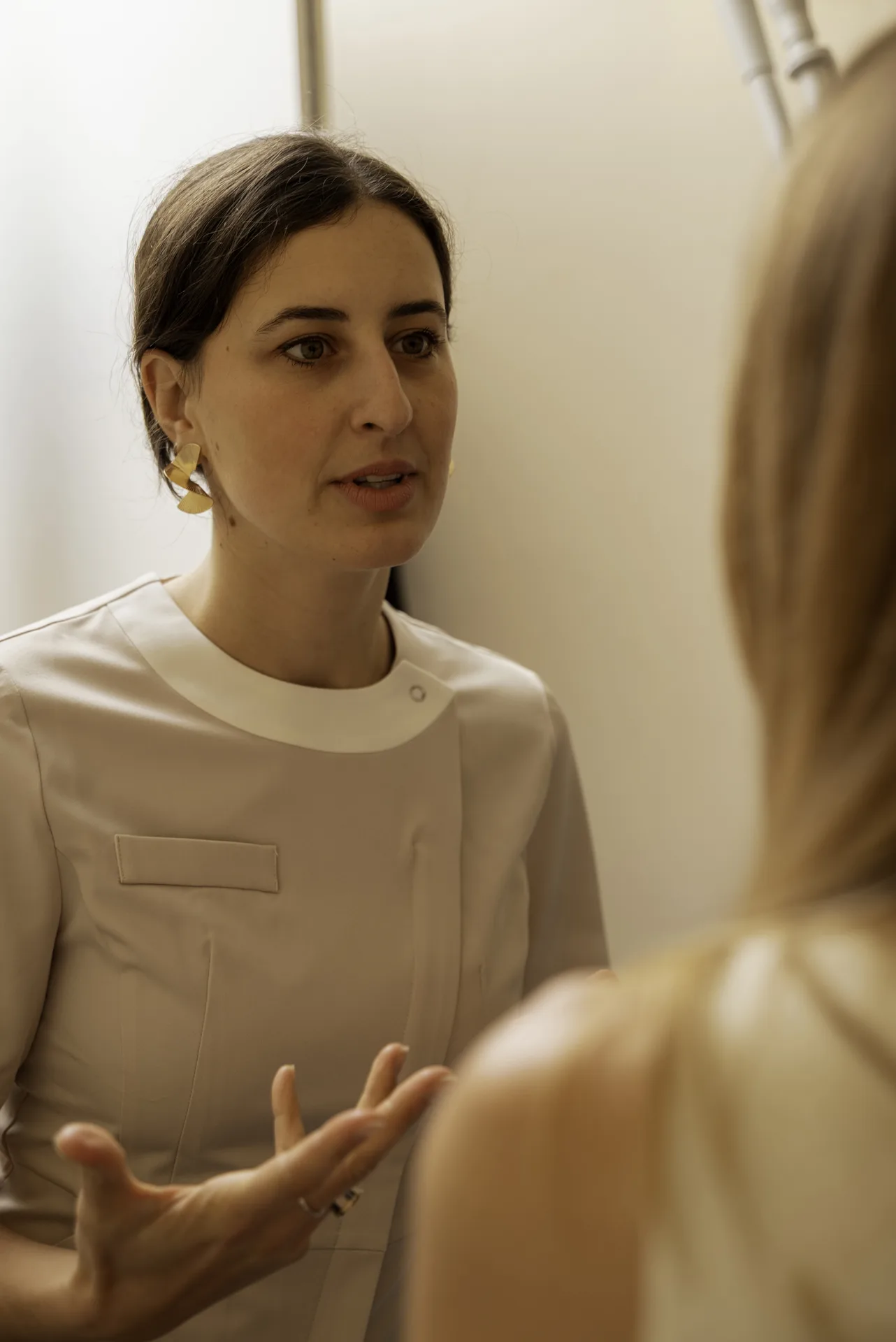 Hydrafacial cost in Islington, London: therapist explaining a treatment to a patient