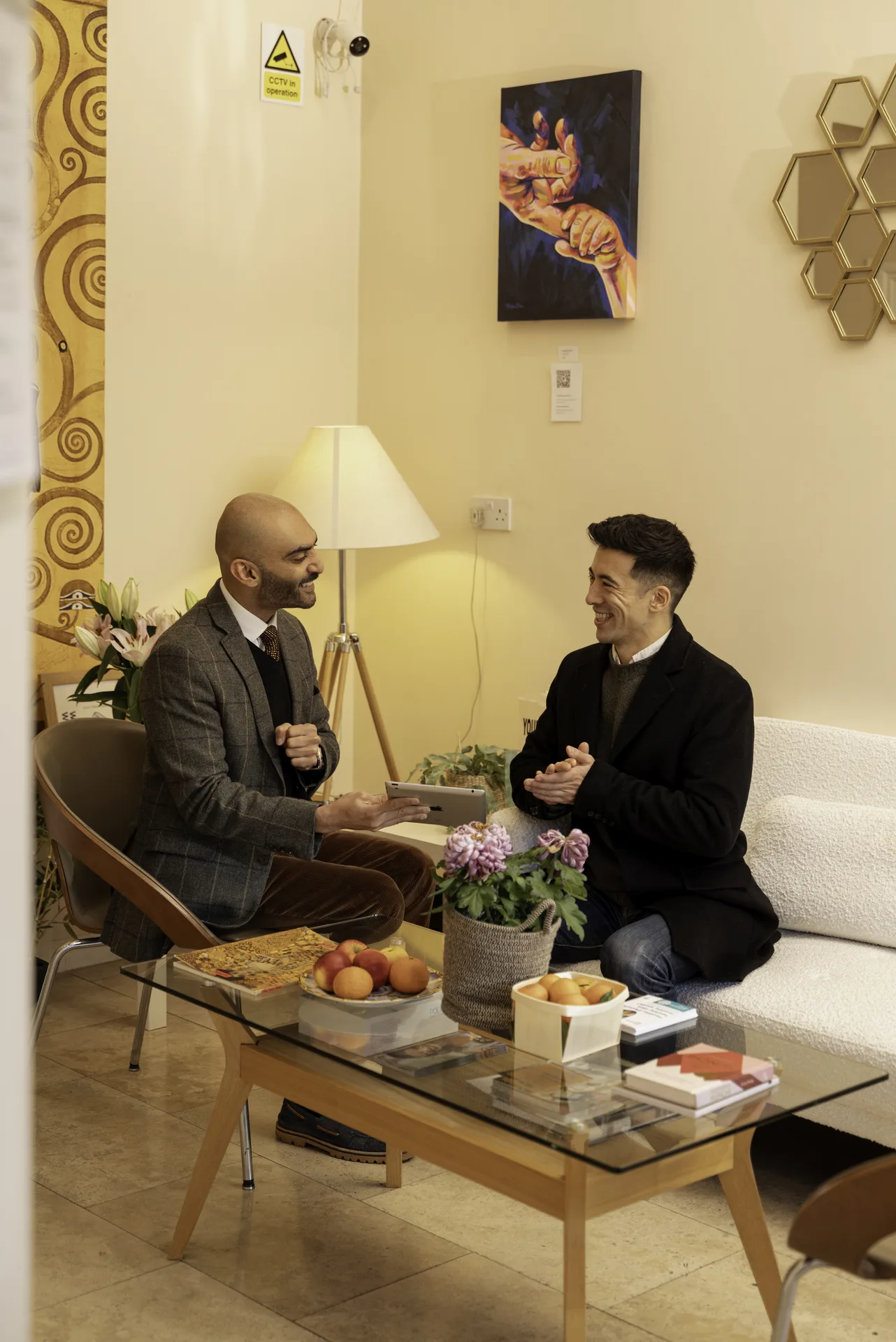 Holistic dentistry in Islington, London: clinician and patient in consultation in the clinic lounge