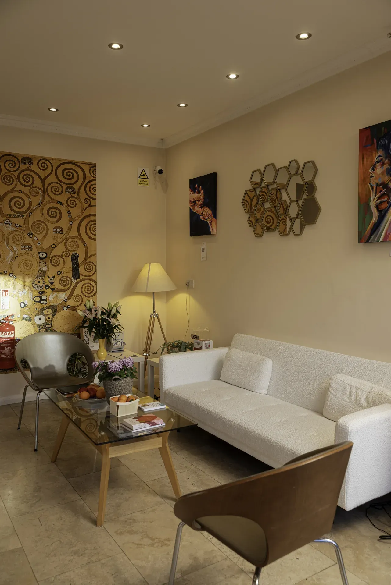 Dentist for Highbury: waiting lounge at Dental & Wellness London with sofas and artwork