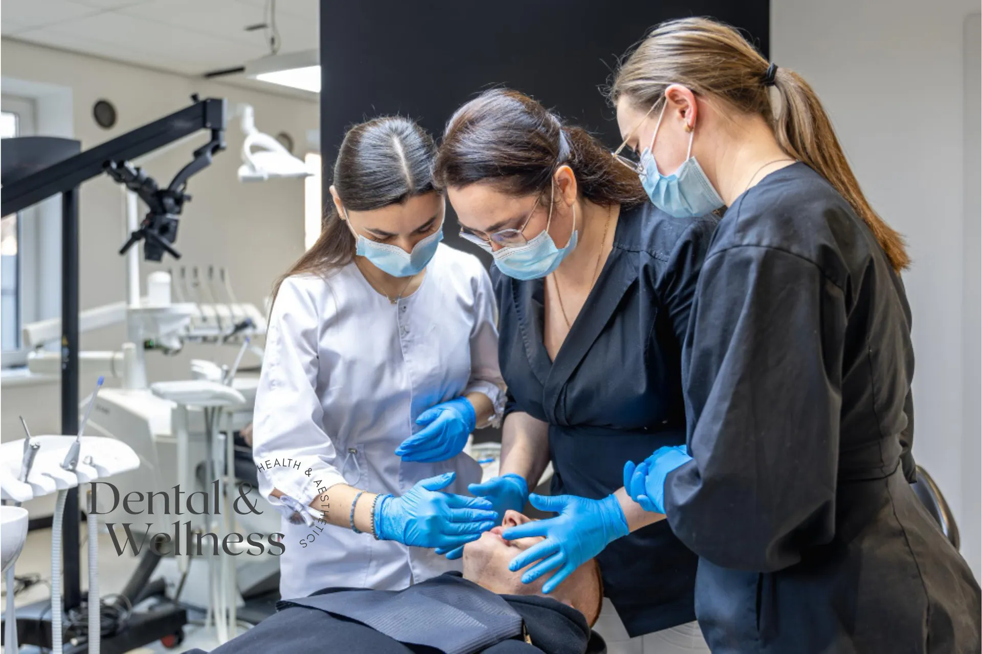 Dental team working together on a patient in the chair