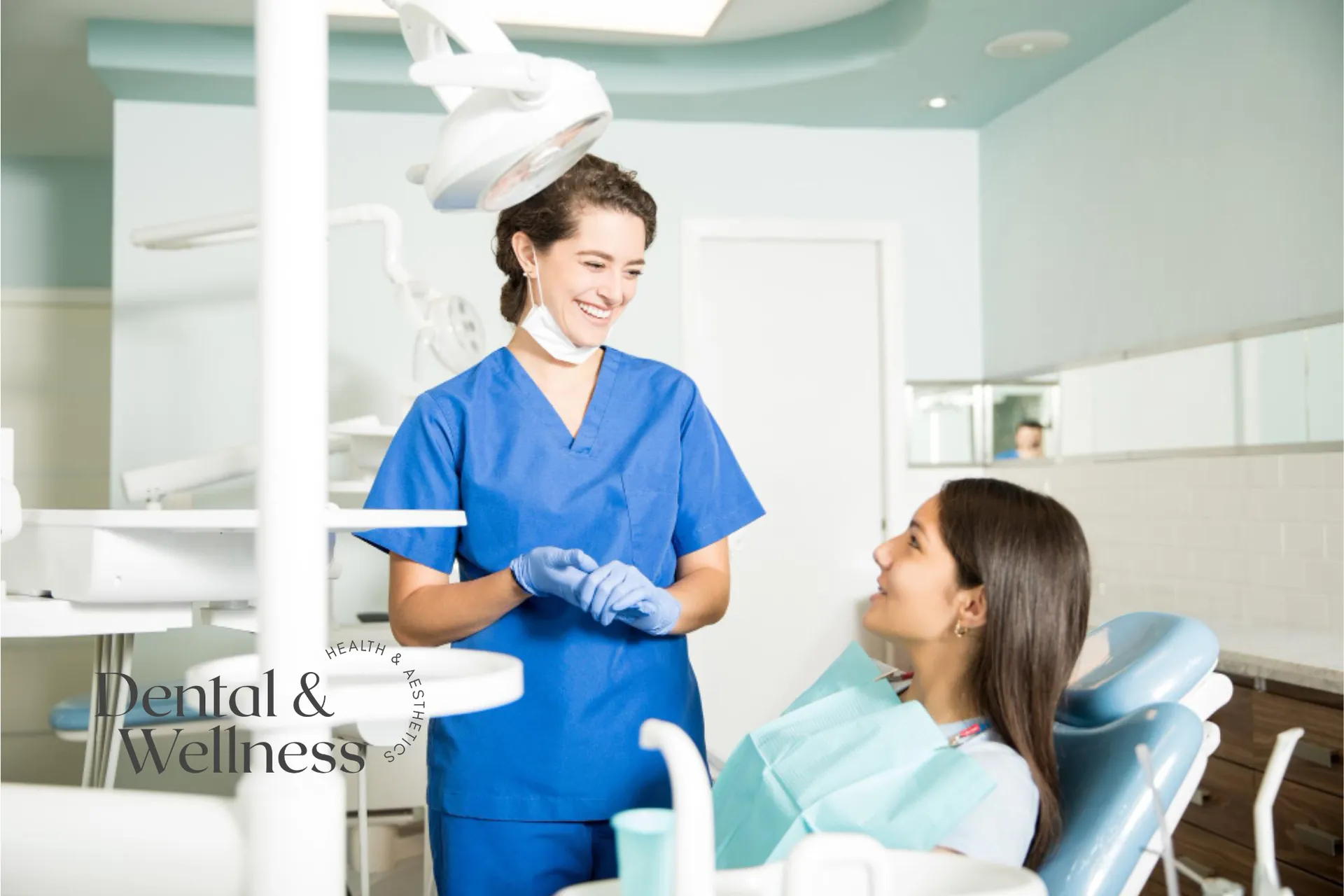 Smiling dental nurse talking with a patient in the dental chair — emergency dentist