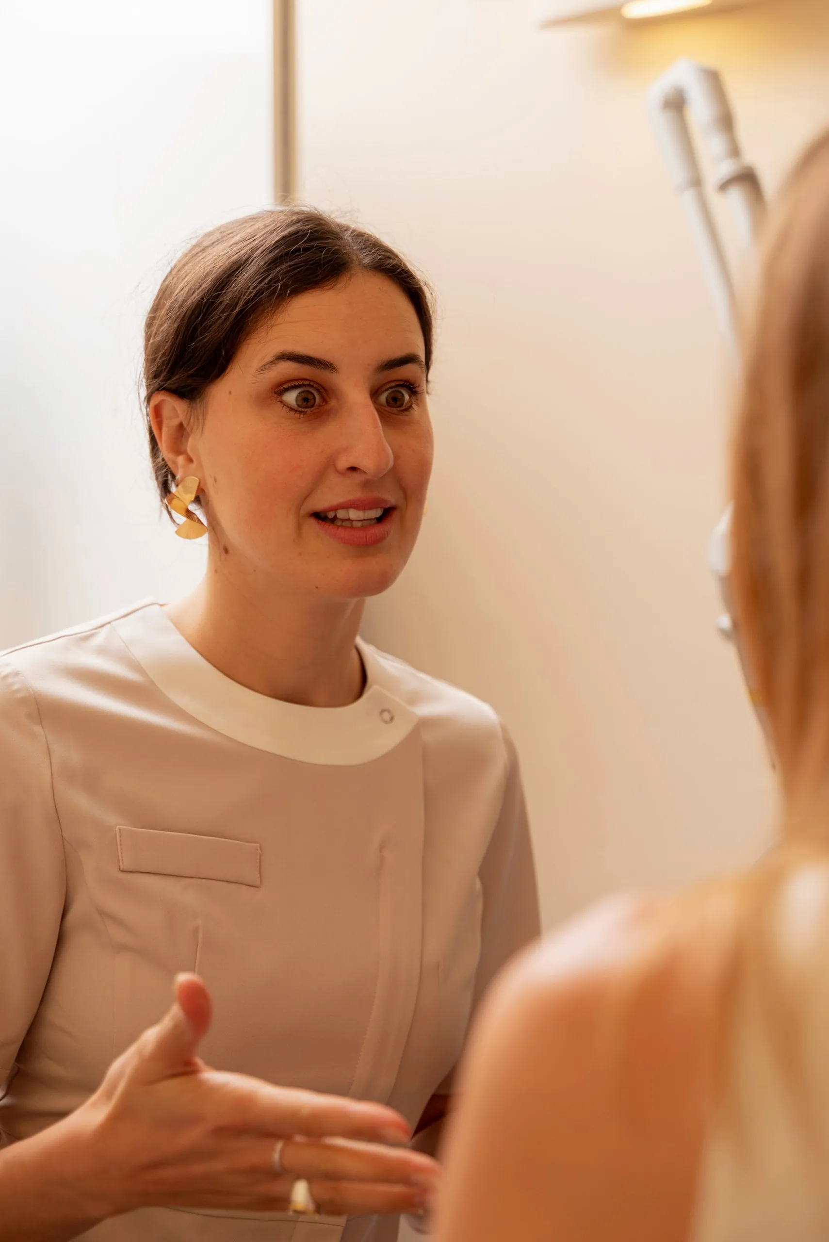 Three TMJ patient paths: therapist explaining a treatment to a patient