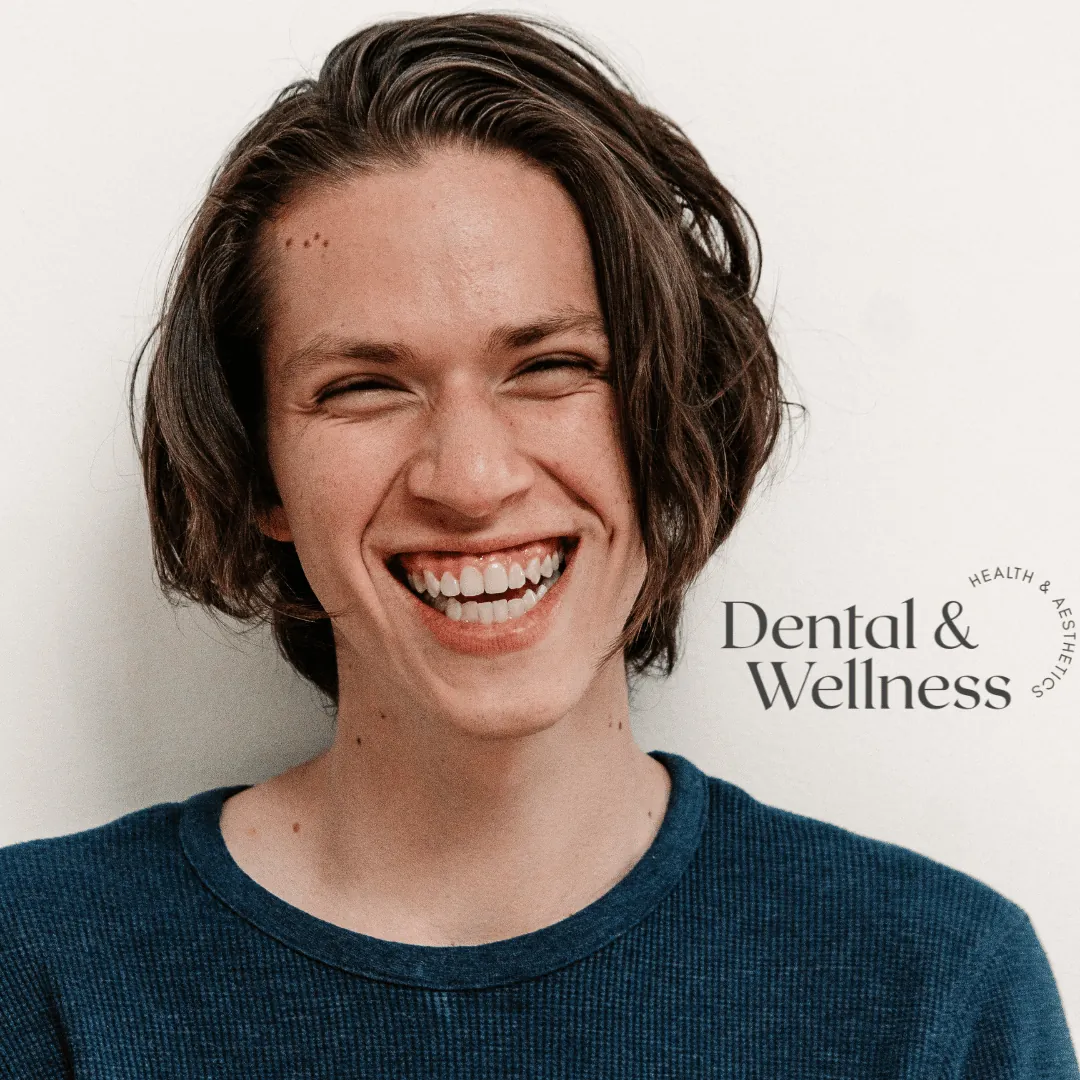Young woman laughing with smile lines around her eyes