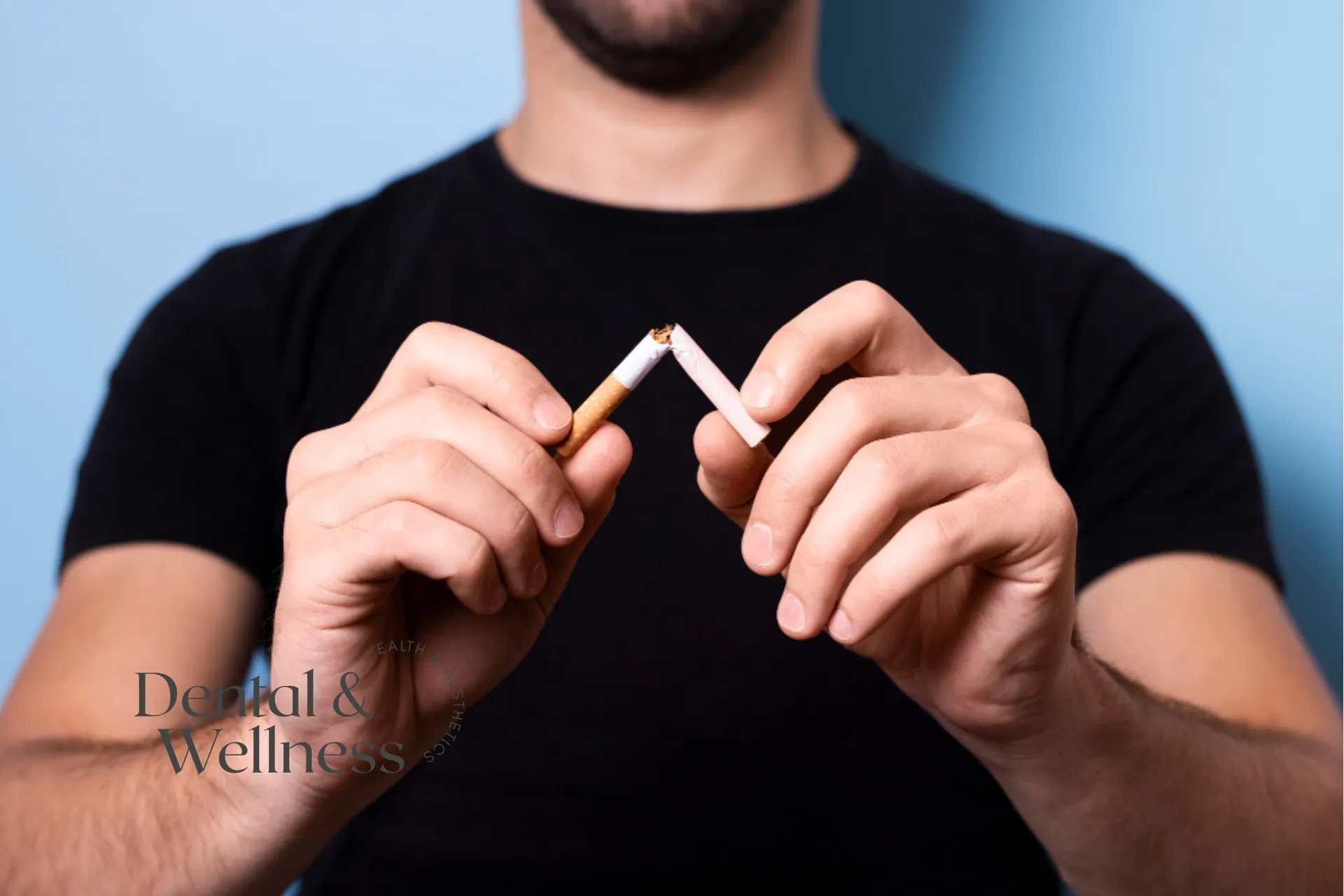 Man snapping a cigarette in half