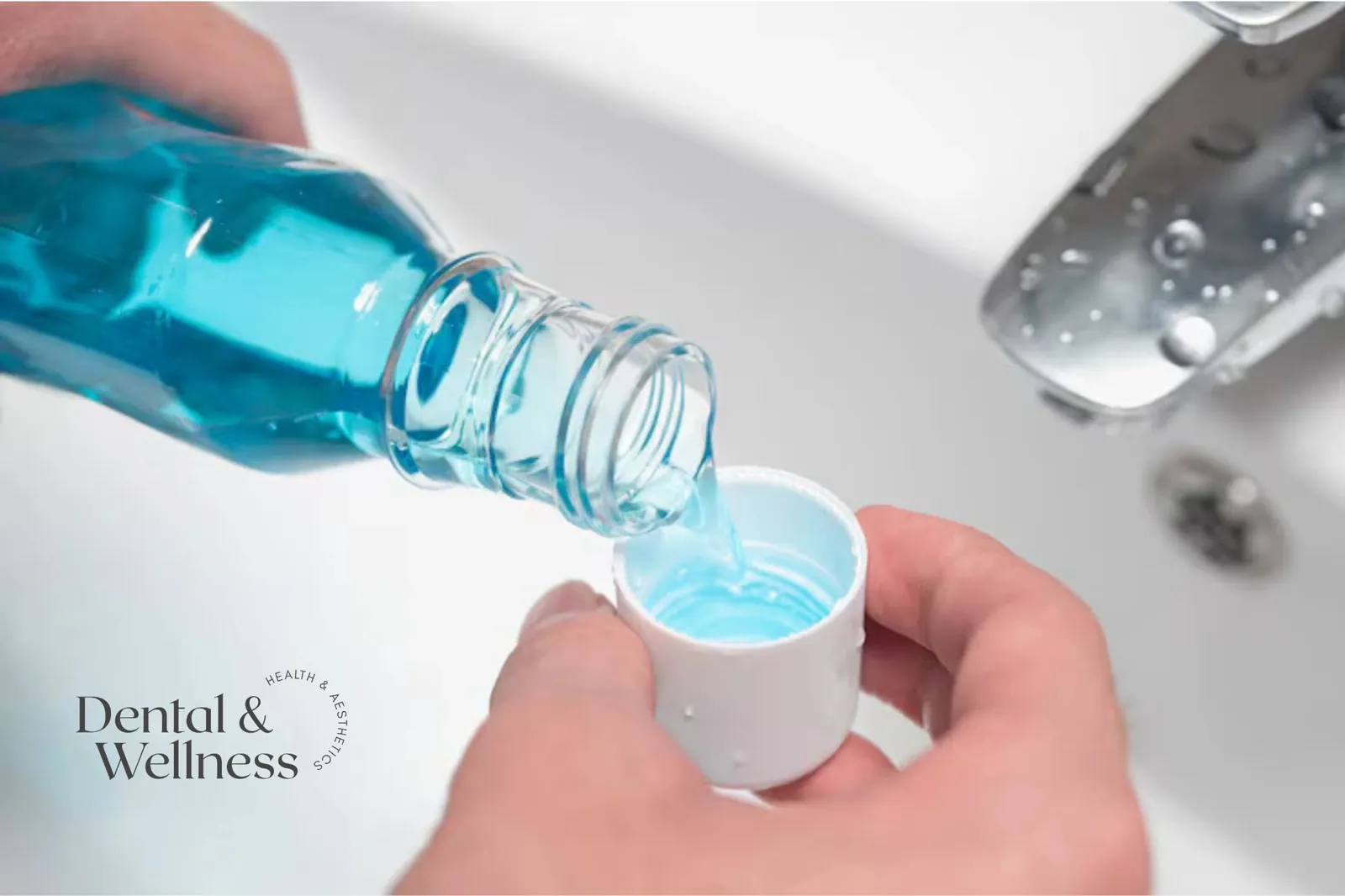 Mouthwash being poured into a bottle cap over a sink