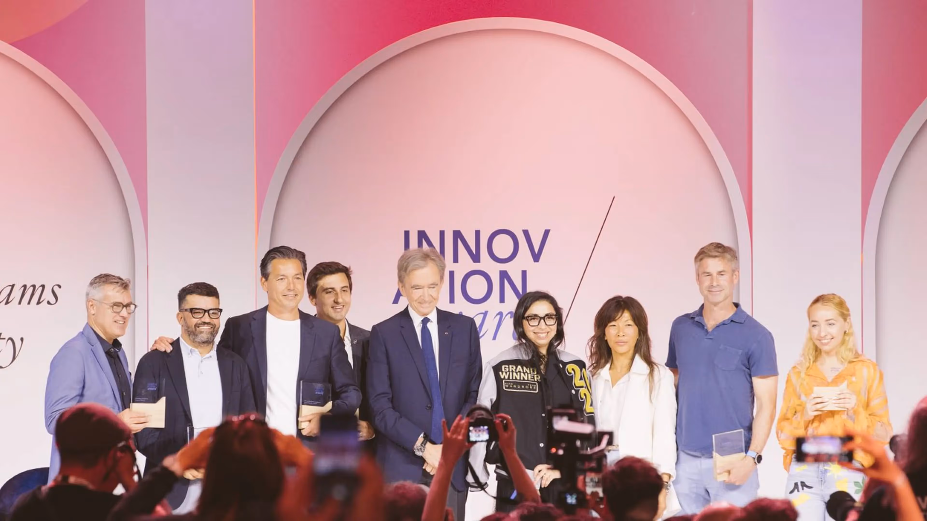 ChatLabs receiving the LVMH Innovation Award for Data & AI on Stage with LVMH CEO Bernard Arnault