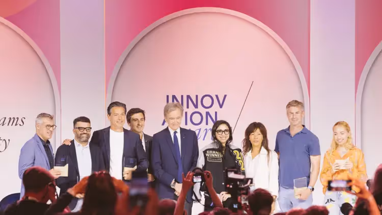 ChatLabs receiving the LVMH Innovation Award for Data & AI on Stage with LVMH CEO Bernard Arnault