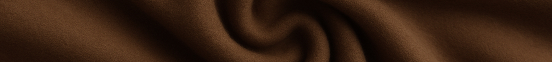 Natural camel hair color swatch in 'Desert Rose', a deep reddish-brown desert tone.