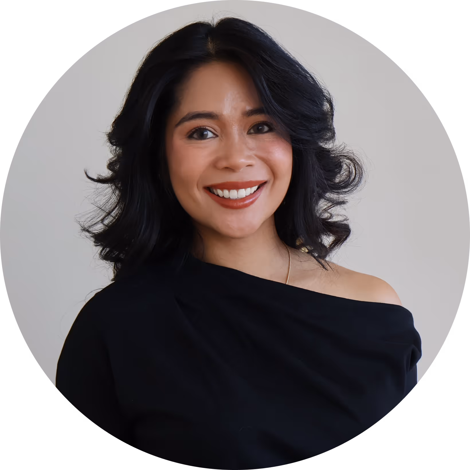 Maeve Perry, founder of The Brand Haus, working on a laptop