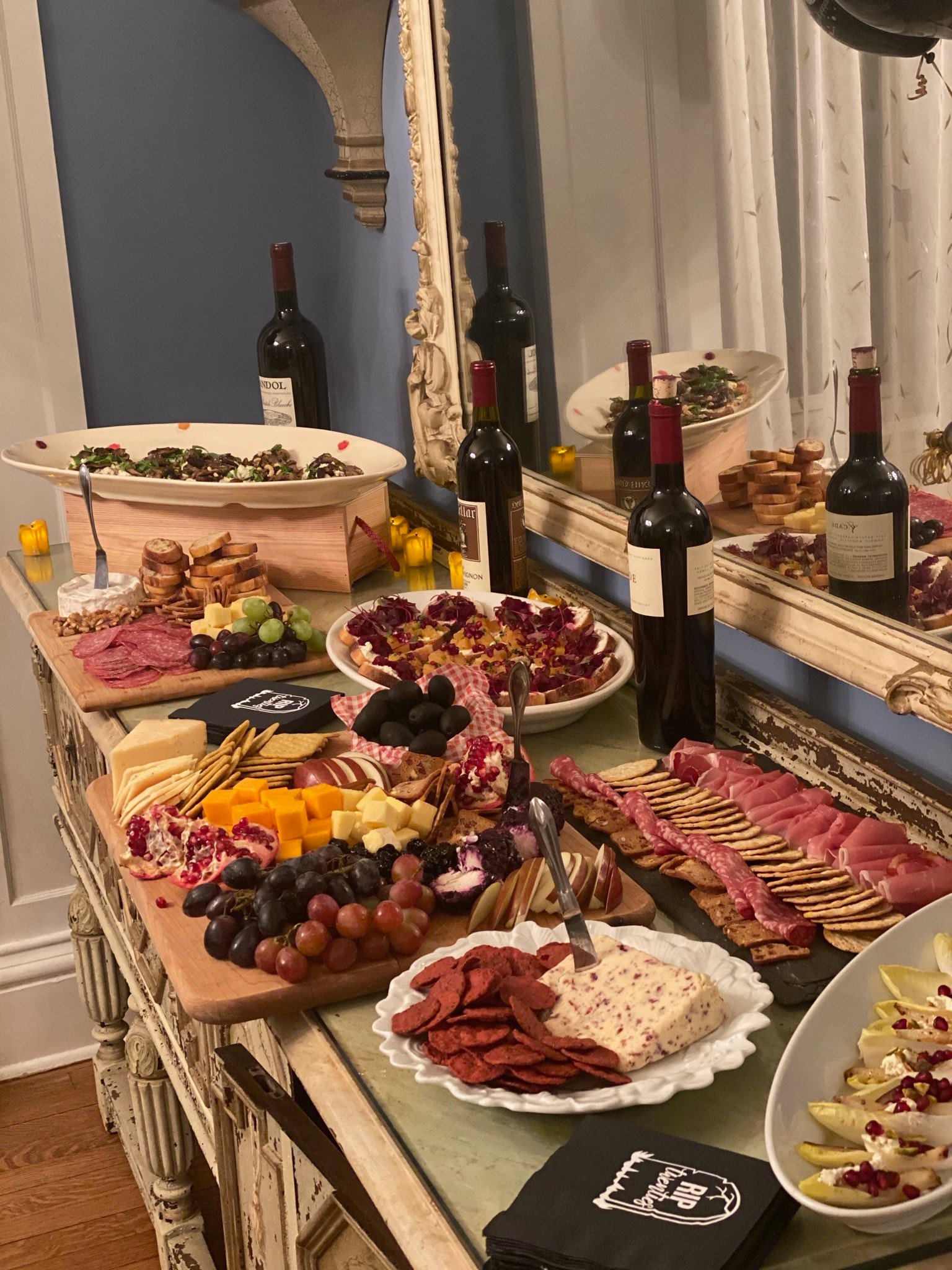 A close-up perspective of multiple appetizer platters, highlighting a diverse selection of handcrafted finger foods and seasonal small bites.