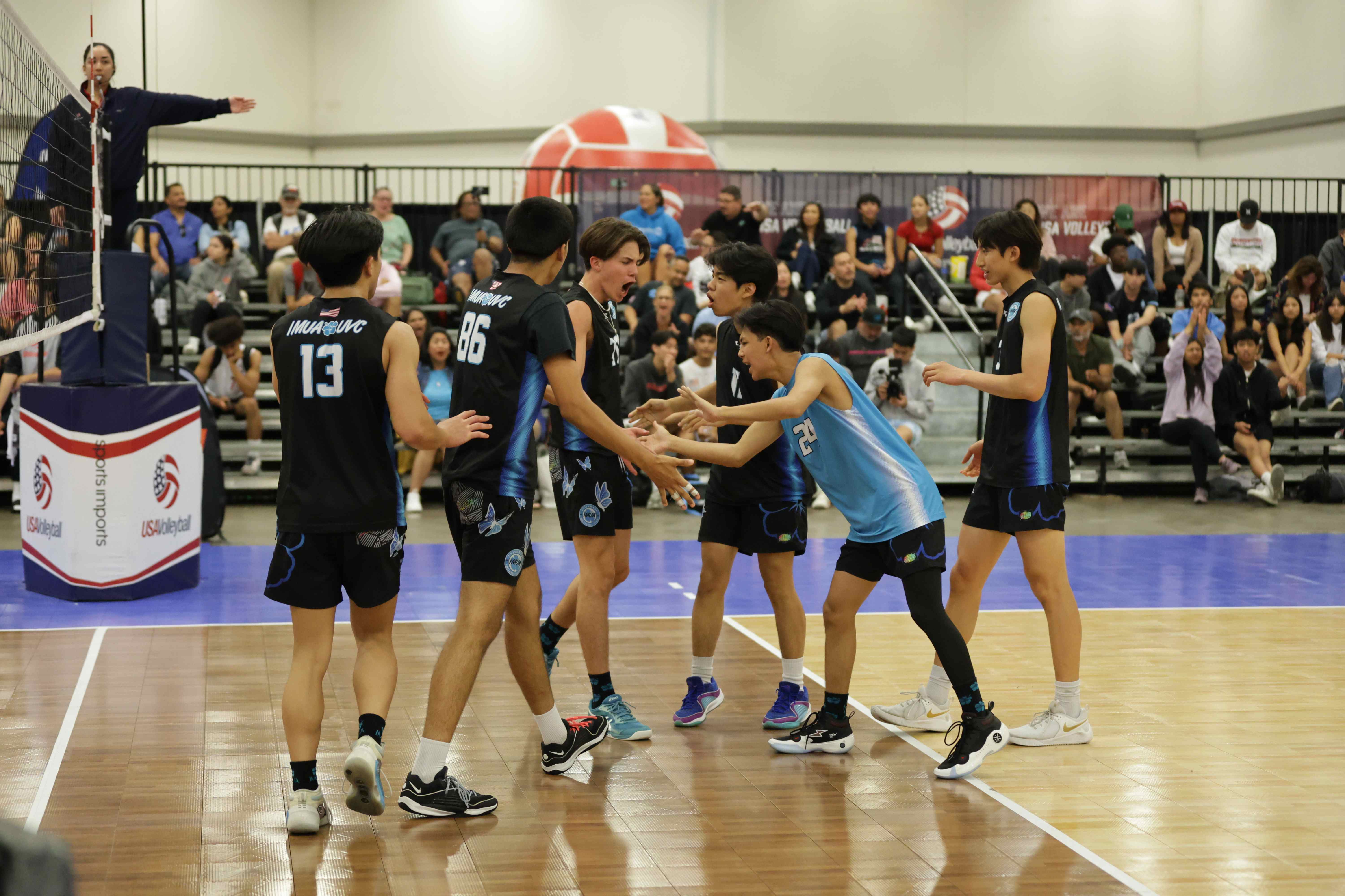 Boys Junio players celebrating a point