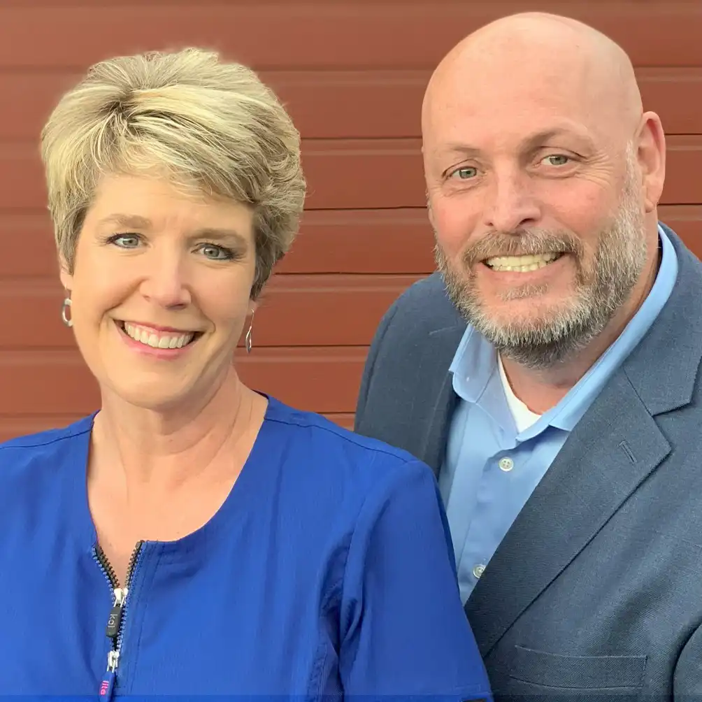 Kari and Cray Campbell, co-owners of EPICC Vascular smiling in professional attire.