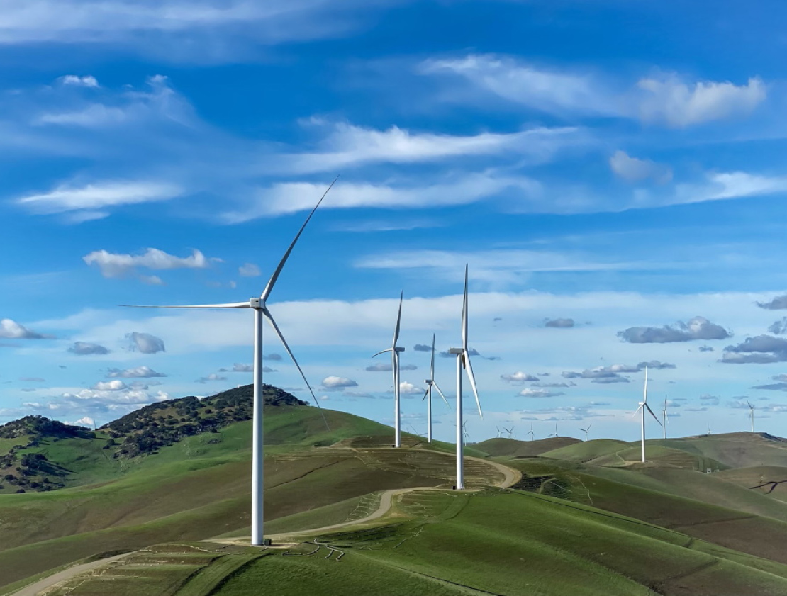 Dozens of wind turbines on a ridge