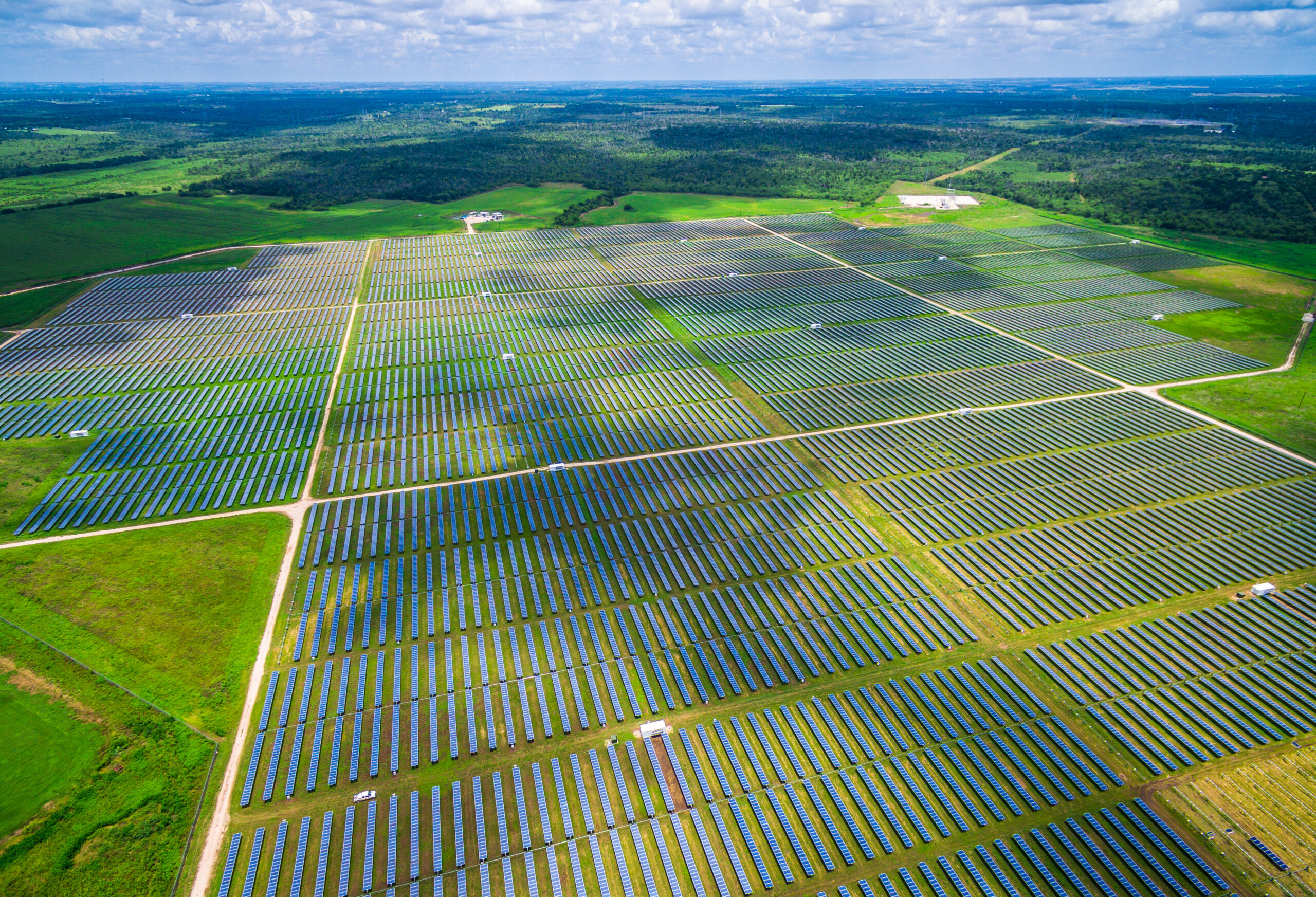 An aerial view of solar panels in a field