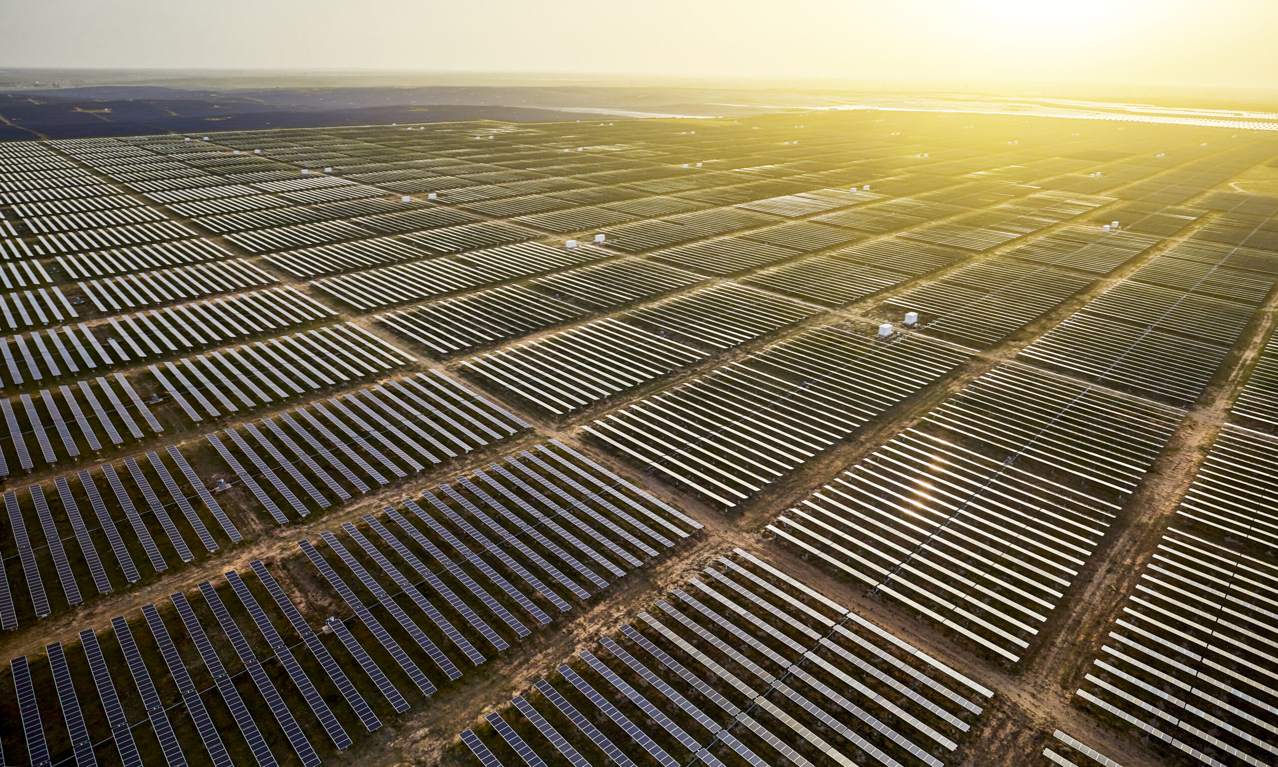 An aerial view of solar panels in a field