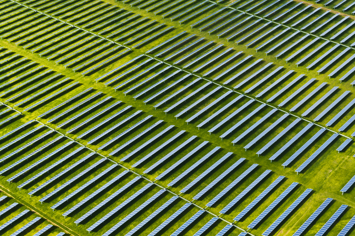 An aerial view of solar panels in a field