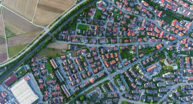 A high aerial view of a neighborhood of homes