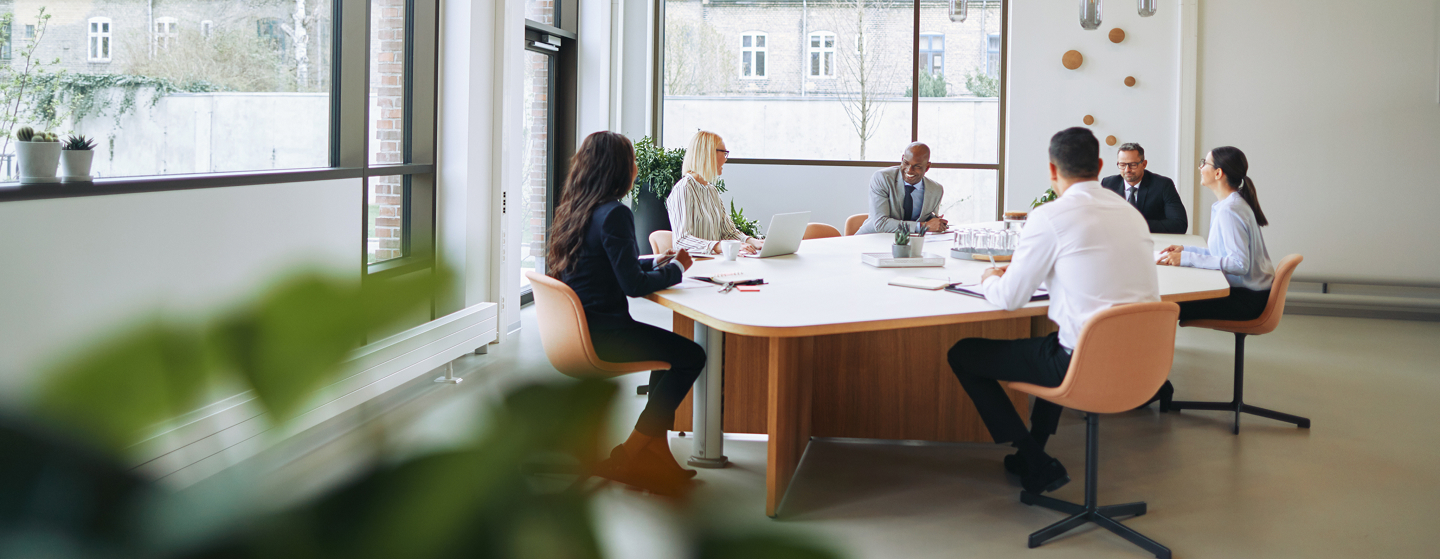 A group of businesspeople having a meeting in a conference room